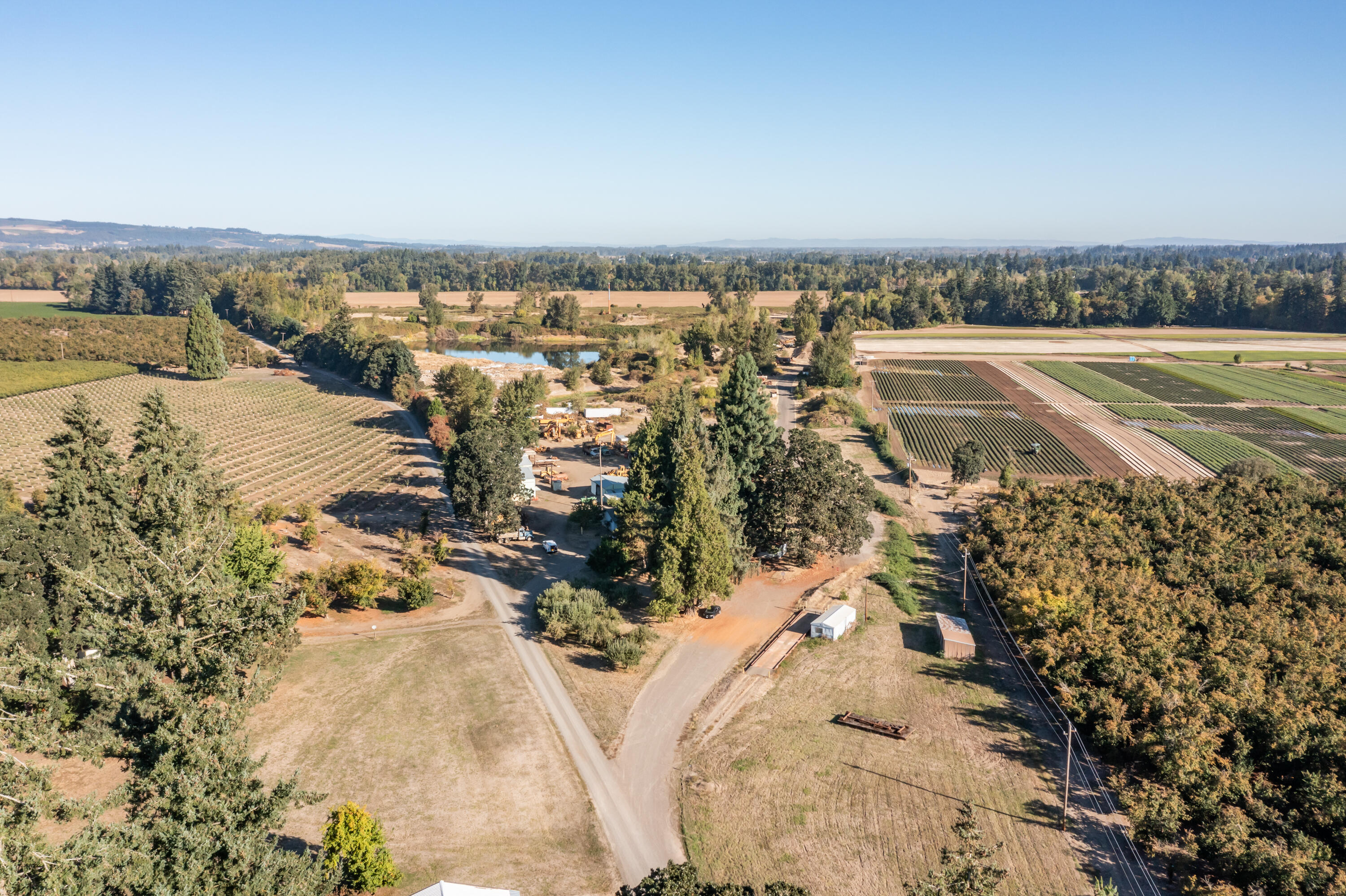 Turnkey West Salem Quarry: 79.6-acre property ready for heavy equipment. Includes a 2800 sq ft home and multiple outbuildings. Benefit from an existing, flexible DOGAMI permit—perfect for continuing the active reclamation/fill business, additional mining or adapting to your new enterprise. North acreage is flat and ideal for a pot-in-pot nursery or material staging. This property has 19 acres of senior water rights.  Formerly an active retail location supplied from River Bend Materials.