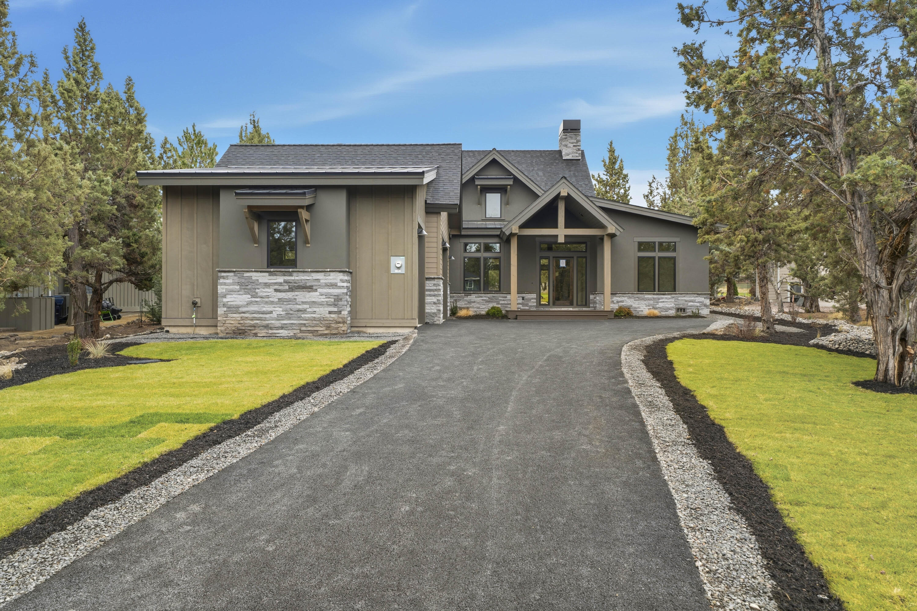 Stunning brand new single-level home located in one of Eagle Crest's exclusive gated communities. 
This custom-built home showcases soaring vaulted ceilings that flood the space with natural light. 
Expansive gourmet kitchen anchored by a large natural stone quartzite island complete with a wine fridge. 
The primary suite features a free-standing soaking tub, separate walk-in shower, and spacious walk-in closet.
Two guest rooms; one with en-suite bathroom, additional full bath, and a dedicated office for work-from-home convenience. The expansive laundry room comes complete with a premium washer and dryer.
Step outside to your private covered cobblestone patio featuring a custom fire pit, perfect for entertaining while overlooking the 12th tee of the Resort Course. 
The exterior blends composition and metal roofing with cultured stone and hand-applied stucco accents. The oversized triple car garage with 9ft doors includes an electric vehicle charger to complete this luxury home.