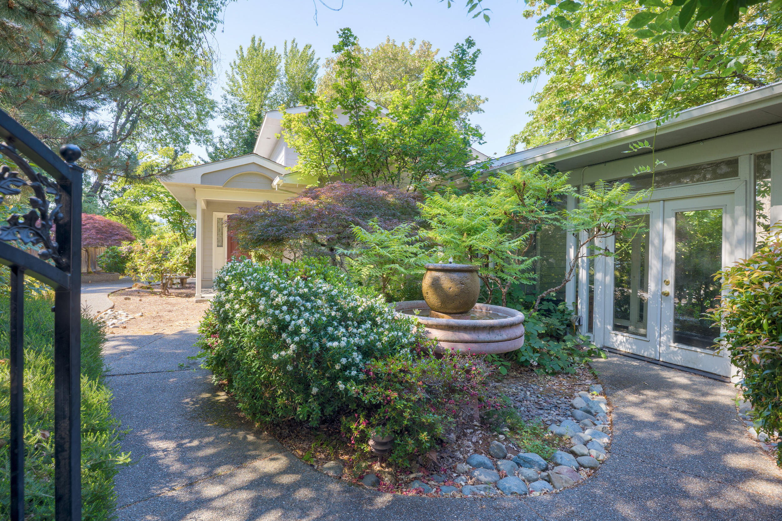This quality 2032 Square foot home on the Rogue River provides a convenient location, river & mountain views, with gated privacy. The large modern kitchen has double ovens, granite countertops, an island cooktop, and stainless appliances. The upstairs primary suite boast a wood burning fireplace, double vanity sinks, a soaker tub, a walk-in closet, and a vaulted ceiling. There are nicely constructed built-in shelves and cabinets throughout. A comfortable gas fireplace is in the dining area with views of the Rogue River. The large deck is an excellent place for outdoor relaxation and entertainment. A 745 sf. ADU above the 5 car garage/workshop provides for additional income. A classy glass breezeway connects the home and garage. all existing furniture is included. Bring all offers-Motivated seller 

Easy to show with 24 hours notice required.