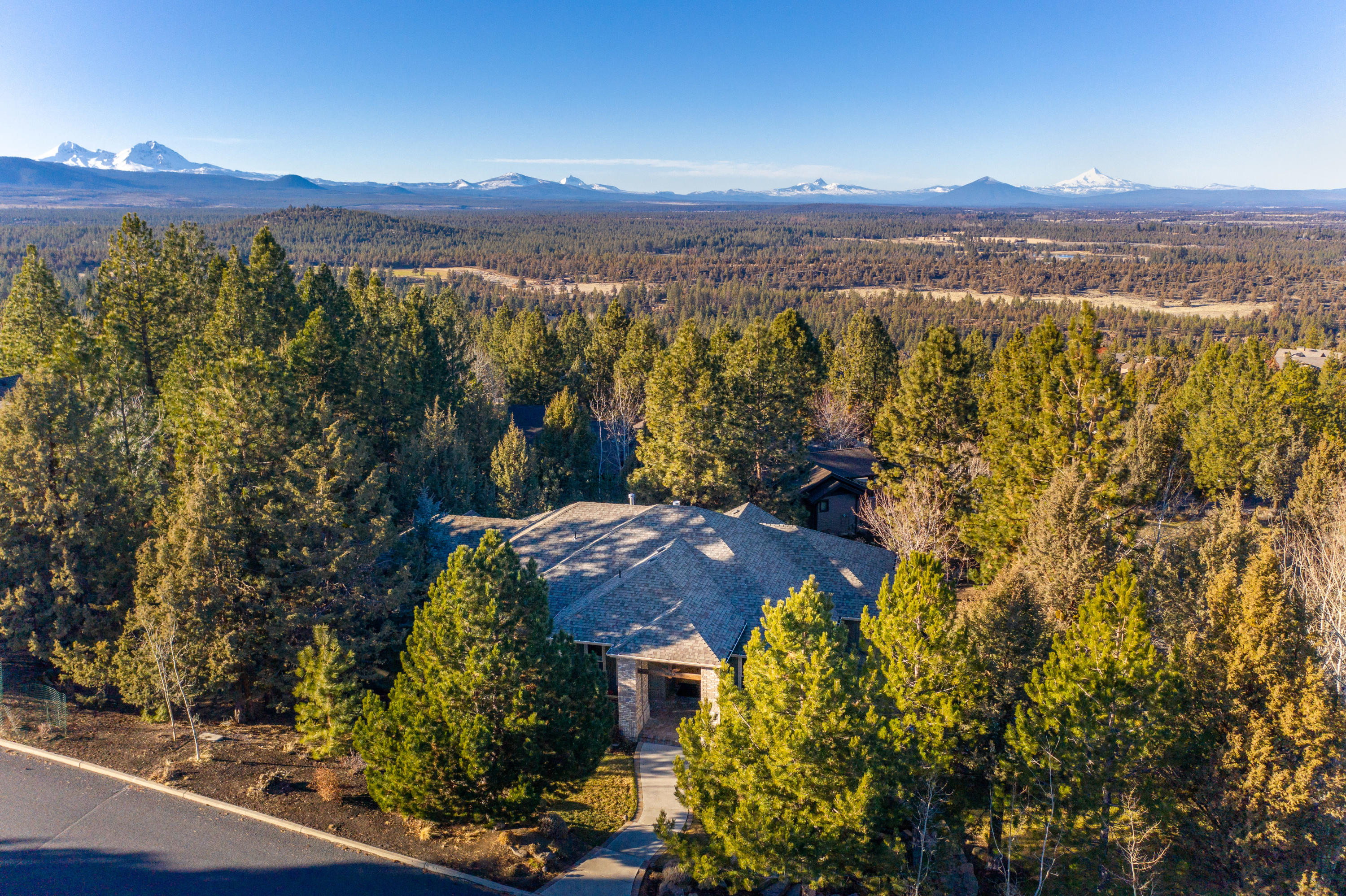 Private, peaceful, luxury retreat on Awbrey Butte!  Set back on a private lot W/ almost half an acre of landscaped grounds & a park-like level backyard.  Thoughtfully designed W/ incredible Mt Jefferson views as you walk in the front door.  5 bedrooms/3.5 baths, office/den, Bonus room, family/theatre room AND home gym.  Tastefully updated and fresh with an open great room feel, vaulted ceilings & wide plank hardwood floors.  Gorgeous gourmet kitchen features quartz countertops & top-of-the-line stainless steel appliances.  The luxurious master suite on the main level is a great way to get away and unwind.  Master bath features jetted soaking tub and dual headed shower. Fantastic home office W/ gorgeous built-in cabinets. The sprawling entertaining spaces flow beautifully & feature incredible game room, theatre room/family room, wet bar & built-in kegerator.  The spacious gym is perfect for your at home workouts. Oversized 3 car garage on a Premier corner lot with a flat driveway!