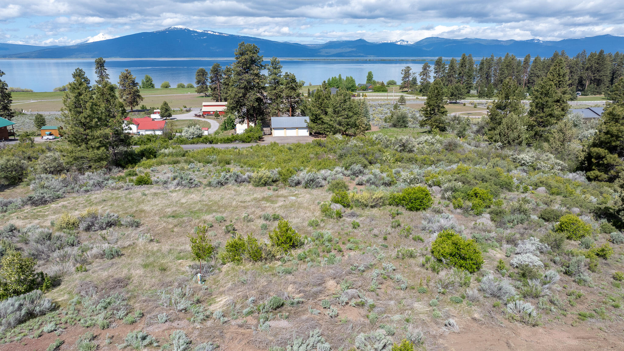 Amazing views from this .63 acre buildable lot that has septic tank and water in place, power is located on the corner of the lot. This beautiful lot is nice and private located in a Cul-de-sac with great views of Agency Lake and the Cascade Mountain Range.