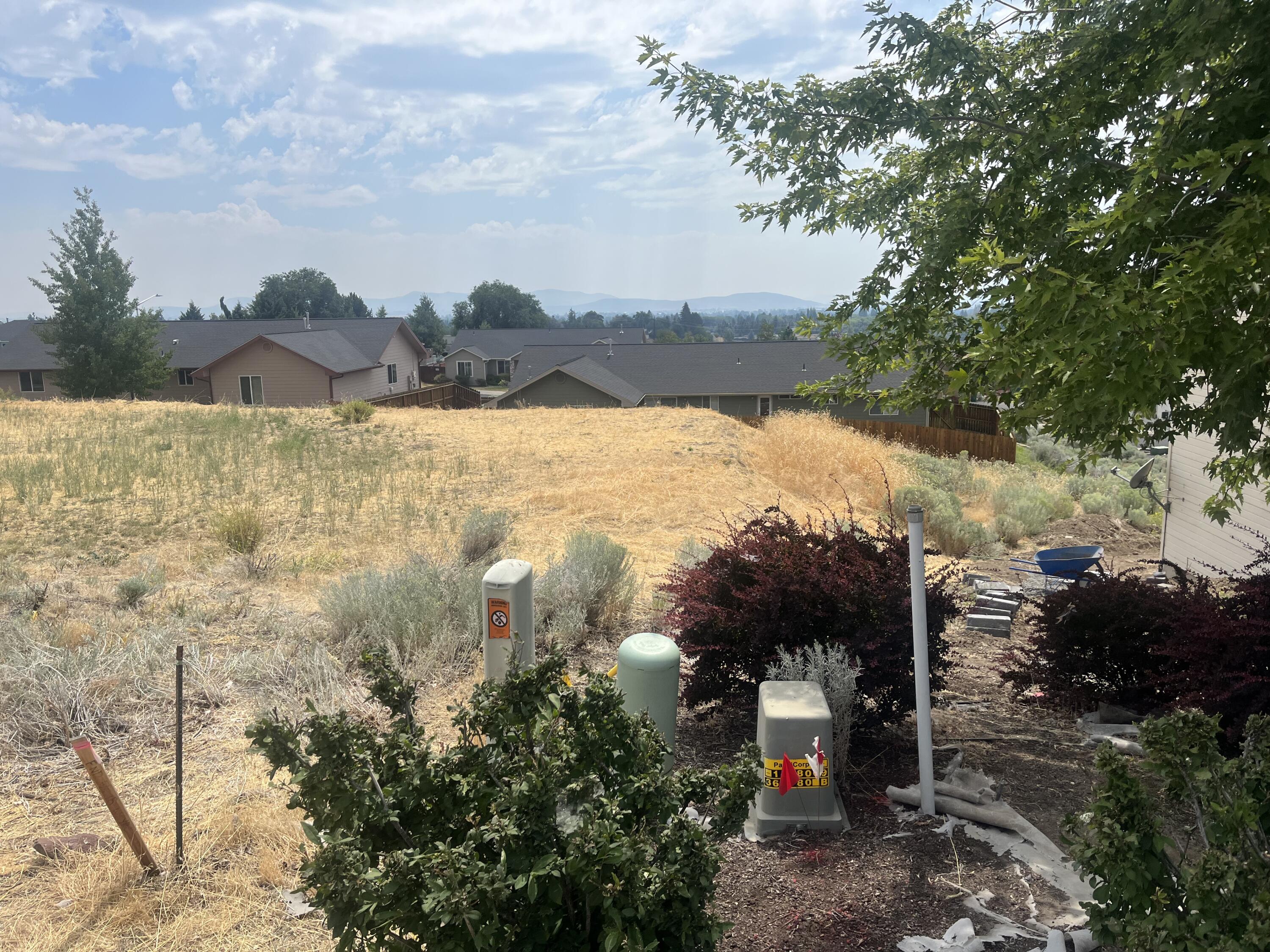 The seller has already done the groundwork for you, providing professionally drawn plans that showcase the limitless potential of this property. Located in the sought-after North Hills, this property is nestled in a peaceful and friendly neighborhood, with a wonderful view of the Klamath Basin. The lot has been flattened, bringing it closer to being ready for a home. According to the city GIS system the water meter is already on the property and a sewer line is on Westview Dr. Buyer to complete their own due diligence.