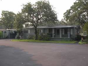 In park (All ages)! Must have DMV license to show space #4. Open floor plan with vaulted ceiling in living room. Well taken care of home. Park rent $300/mo. Ask for Sandy or Tom to show due to elderly mother. First driveway to park from W. Gregory. Carpets 6yrs old, roof is 3yrs old w/ 8 x 8 shed (white). Home has lots of storage.