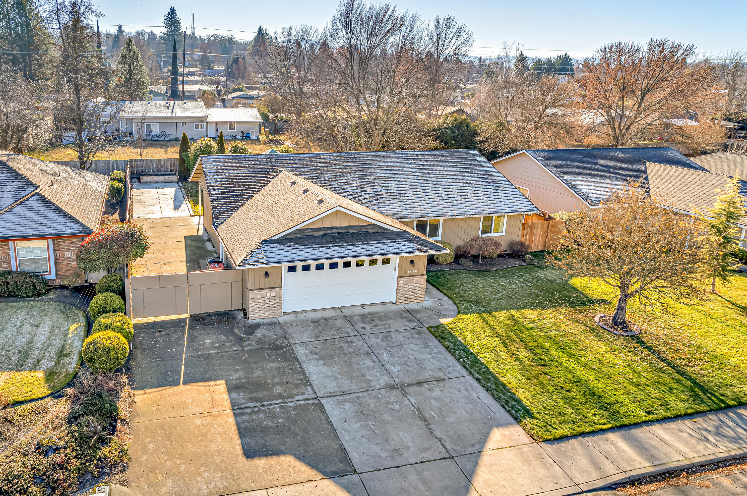 Come fall in love w/ this E Medford home! With open living space, HUGE RV parking & a nice backyard, this is the home you have been waiting for! This single level home is located in the Lone Pine School district & has enjoyed some nice updates over the past 2 years. The kitchen is light, bright & open & has been nicely remodeled w/ new cabinet doors, an added island & new light fixtures. New laminate floors & baseboards were installed in all of the common areas. Spending time outdoors will be enjoyed on the covered patio or in the nice-sized backyard shaded by a large, mature tree. If you need parking for your toys, you'll love the expansive, gated RV parking. To top it all off, there is a large 8' x 24' shed w/ power that provides ample storage or maybe a small workshop. Other recent updates include laundry cabinets, new water heater & garage door. Home comes w/5.5 yr home warranty. New roof installed 1/27/23! You'll want to see this home!
