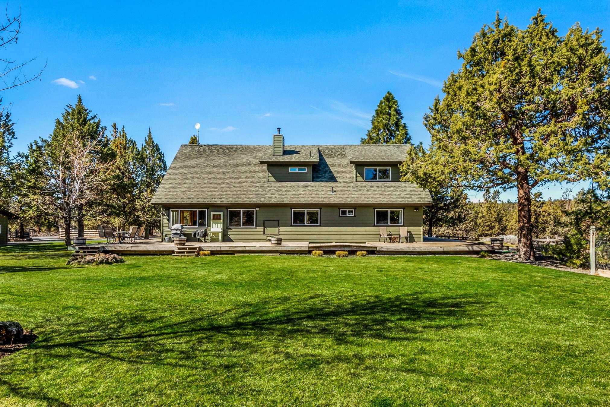 Abound with natural light, this custom home sits on 7 acres in a premier West Tumalo location. Inside you will find an open floor plan with high vaulted, tongue and groove ceilings, two master suits, a free standing fireplace with a natural stone surround, custom metal railing and a balcony reading loft. The light filled kitchen features cherry cabinets, stainless steel appliances, tiled backsplashes and a large island. In addition to the 2 car attached garage there is a heated 4 bay shop with an adorable second story guest quarters, complete with a living room, kitchen, bedroom, bathroom and laundry. Outside you will find a barn with paddocks, fenced dry pastures, a large three sided hay storage building and a high producing private well with a cistern. The location of this property and its proximity to Tumalo Reservoir make it ideal for horseback riding, Mt biking, hiking, bird watching, and many other outdoor recreational activities.