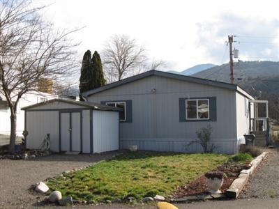This efficient 2 bd/2 ba open floorplan 1996 Super Good Cents home has it all! Walk-in closet, vaulted ceilings, large utility room, double paned windows, ceiling fans, large shed and includes all appliances! Space rent of only $350/month includes water, sewer, garb & irrigation. Home needs a little TLC but is an incredible value in today's economic climate!!