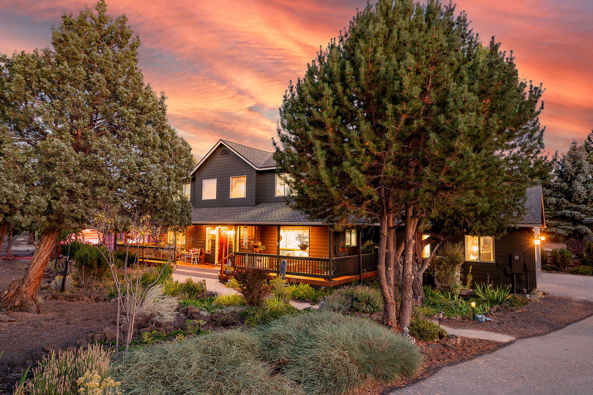 New Price! Embrace the best of country living in this beautifully crafted, farmhouse-inspired retreat featuring a welcoming wrap-around deck & direct access to more than 13,000 acres of pristine BLM land. With 3,086 sq. ft. total, the property offers a spacious 3 bed, 2.5 bath main home w/ an office, and a 704 sq. ft. single-level 1 bed/1 bath garage conversion—ideal for extended living. Thoughtful finishes include premium pergola flooring, granite kitchen counters, a cozy free-standing propane stove, & three mini-splits ensuring year-round comfort. Outside, enjoy a large shop with RV/boat parking, an enclosed gazebo, manicured landscaping, & an owned alarm system for added peace of mind. Recent improvements—new exterior paint & a 2024 roof—provide lasting value. Perfectly positioned near Bend Airport, the new Costco, shopping, dining, trails, & major travel routes. Set in a quiet area this property delivers privacy, and true Central Oregon living at its finest.