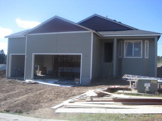 New Construction should be done middle of August.Three Car Garage,Custom Oak Cabinets,Formica countertops,Tile Flooring in bathrooms and laundry room, Carpet in all three bedrooms, Hard surface flooring through entry,living room, kitchen, dining, and family room and down hallway. Front yard landscaping with inground sprinklers, Backyard Fenced, Still time to add or change to customize but will have additional cost. One year contractor warranty.