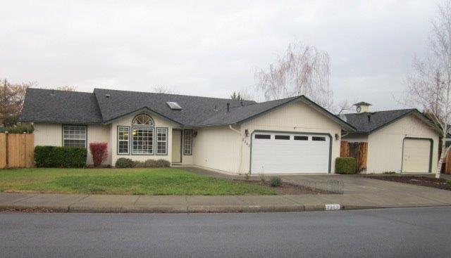 Great East Medford home with wonderful updates and an insulated 20x24 ft. shop w/ natural gas heat & RV parking area! This single level home has a split master plan and includes Beam central vac system. Stainless appliances, healthy air filtration system, built-in display cabinets, upgraded red oak hardwood, new roof in 2006, new carpet in 2015, see thru Napoleon gas fireplace, 2 private patios, and a large garden area with concrete walk paths, fencing and full sprinkler system and much more!