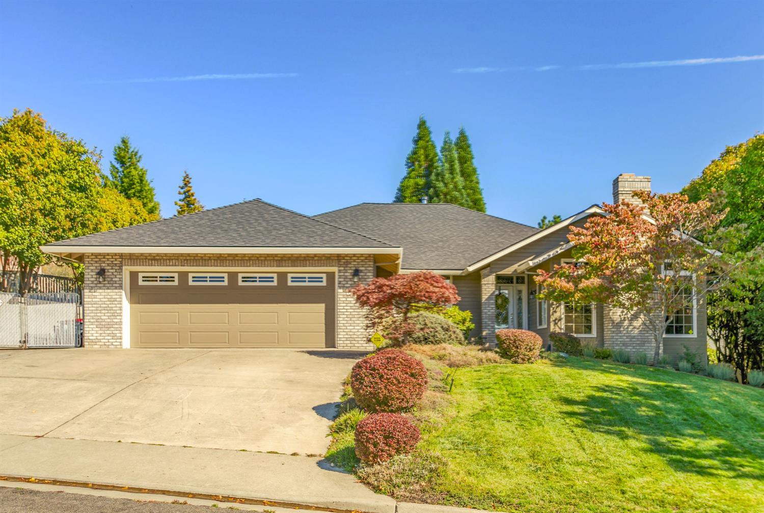 This beautifully updated and maintained East Medford home on a spacious view lot with mature, well-manicured landscaping, offers a very relaxing and pleasing living environment. Functional kitchen with new appliances including beverage refrigerator and recently installed porcelain tile flooring as well as matching tile in the entry area. The dining and family rooms have hardwood laminate throughout. A certified wood stove resides in the family room, providing pleasant ambiance for a winter evening. The living room offers a wood-burning fireplace and sunset views across the valley. The spacious vaulted master suite includes slider door for private access to the large covered deck, and the master bath is complete with jetted tub and separate shower / commode area. An approximately 60 ft long parking area provides lots of room for your boat or other toys. Don't miss this opportunity to tour a wonderful home. Sale includes ALL appliances and a $2000.00 carpet allowance!