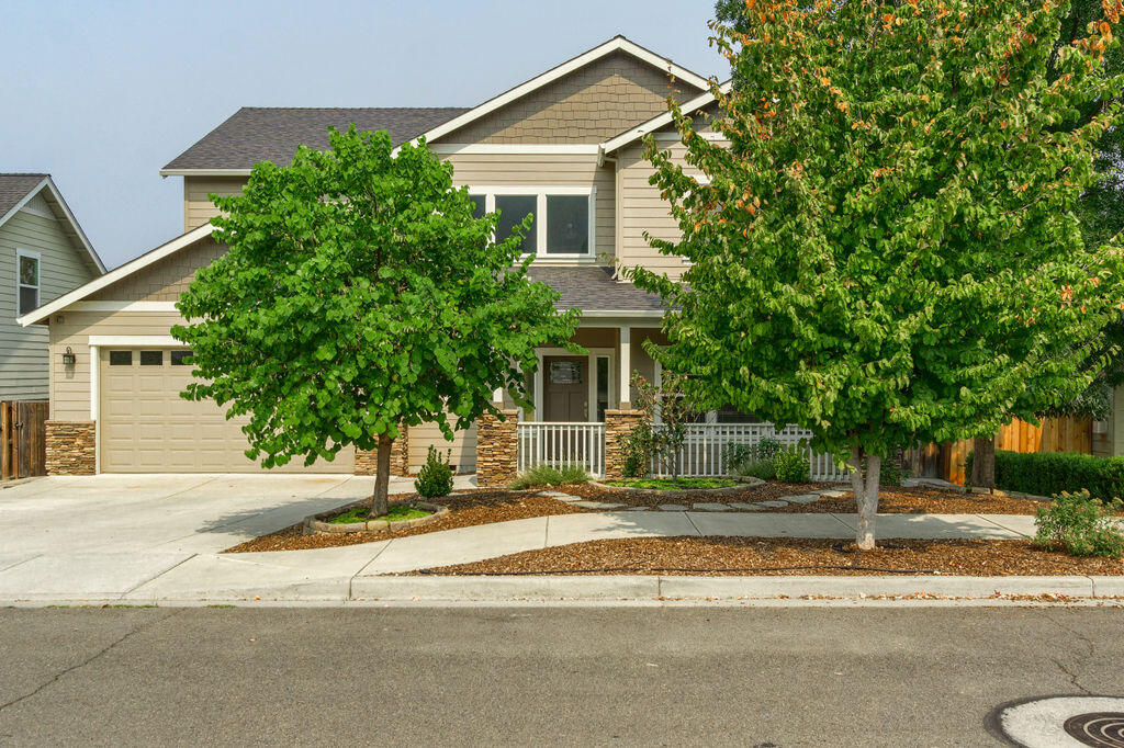 Custom built, spacious home located on the South end of Talent, in a sought after neighborhood. Quality materials throughout including tile flooring in the dining and kitchen areas, custom Cherry cabinetry, slab granite countertops in the kitchen and bathrooms and stainless appliances. Versatile and functional open floorplan including two living spaces, formal and informal dining areas.  All four bedrooms are oversized and located on the second level. Gorgeous owners suite offers a large walk in closet, beautifully tiled bathroom with dual sinks, corner soaking tub, roomy tiled shower and peek-a-boo view of Grizzly Peak. You wont be short on storage throughout the home and attached garage. Laundry sink, pantry storage and central vac. Lovely covered patios in the front and rear yards. Newer exterior and interior paint.  You aren't going to want to miss this one.