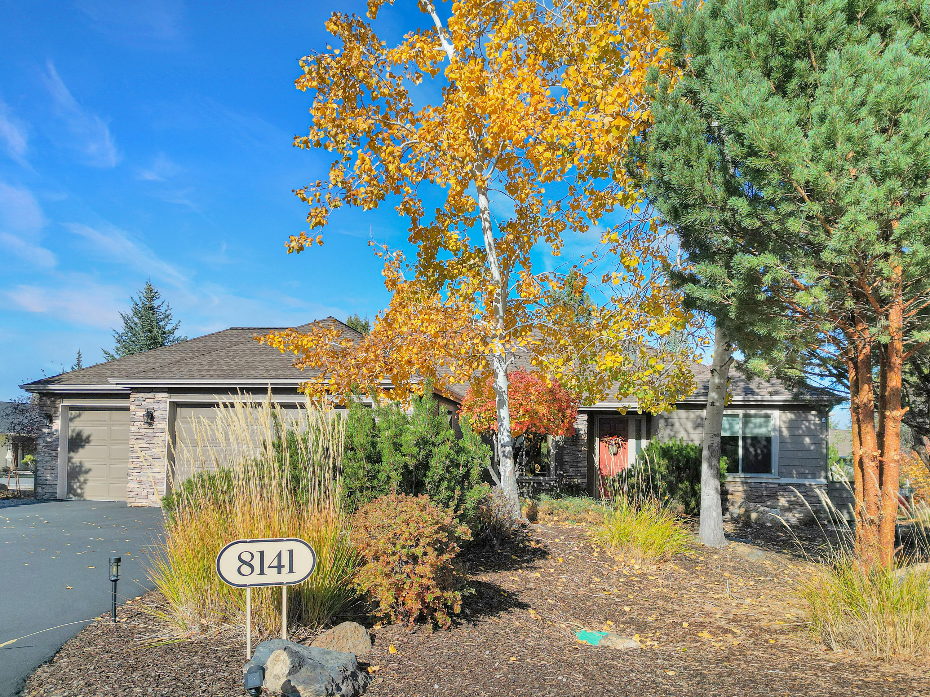 Discover refined living in The Falls at Eagle Crest, a premier 55+ community offering resort-style amenities and an active Central Oregon lifestyle. This immaculate single-level home features 3 bedrooms plus an office, 2.5 baths, and an open floor plan designed for both comfort and entertaining. Recent updates include a new roof and an advanced air filtration system designed to handle Central Oregon's dust and summer smoke. The fully finished 3-car garage adds both functionality and space for hobbies or storage. Additional thoughtful touches include a built-in wall safe and a universal entertainment system. Every detail reflects quality craftsmanship and care—pride of ownership truly shines throughout. Enjoy a low-maintenance lifestyle surrounded by golf courses, walking trails, pools, and fitness facilities—all within one of Eagle Crest's most desirable neighborhoods.