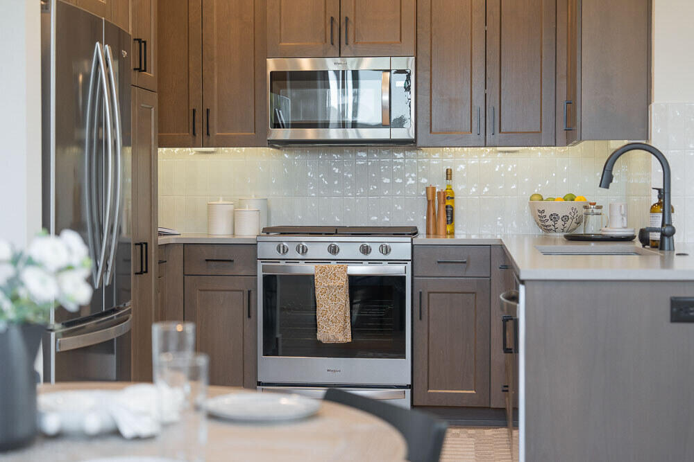 Easton Phase 2 - Homesite #124 - UNDER CONSTRUCTION - Introducing the new 1,450 sq ft Parkside floor plan on Lot 124 with an estimated completion of January—designed for modern living. It features quartz countertops, wood composition flooring, a gas fireplace, tile backsplash in the kitchen and bathrooms, tankless water heater, air conditioning, fenced yard, and a side patio. The HOA maintains the front yard for easy living. Located in Easton, a thoughtfully planned community in SE Bend, residents enjoy access to green spaces, swimming pools, a gym and more. Live where convenience meets comfort in one of Bend's most exciting new neighborhoods. Photos are of a similar model; finishes and floor plan may vary.   Buyer bonus available when using builder's preferred Lender.  See site agent for details.