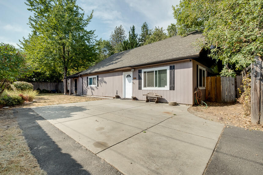 This is a must see! This 3 bedroom 2.5 bath home sits off the road on .26 acres. Downstairs there is a master bedroom and office/extra bedroom, half bath, large living room and open kitchen. Moving upstairs there are 2 large bedroom and a full bath. The back yard is large and with a little TLC has so much potential. Right behind the fence in the back yard for a small yearly fee you have water rights and private access to Sand Creek!