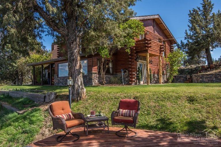 Exquisite, custom, log cabin style oasis on over 12 acres offers beautiful, panoramic views from the Cascade Mountains to Smith Rock. This spacious home offers pergo wood flooring throughout, granite kitchen and bathroom counters, and vaulted open beam living room with a loft and stone fireplace. Best of all, this horse property has a newly finished, matted two stall barn with foaling and grooming. This fenced and cross fenced property backs up to BLM on two sides! See attached amenities list.