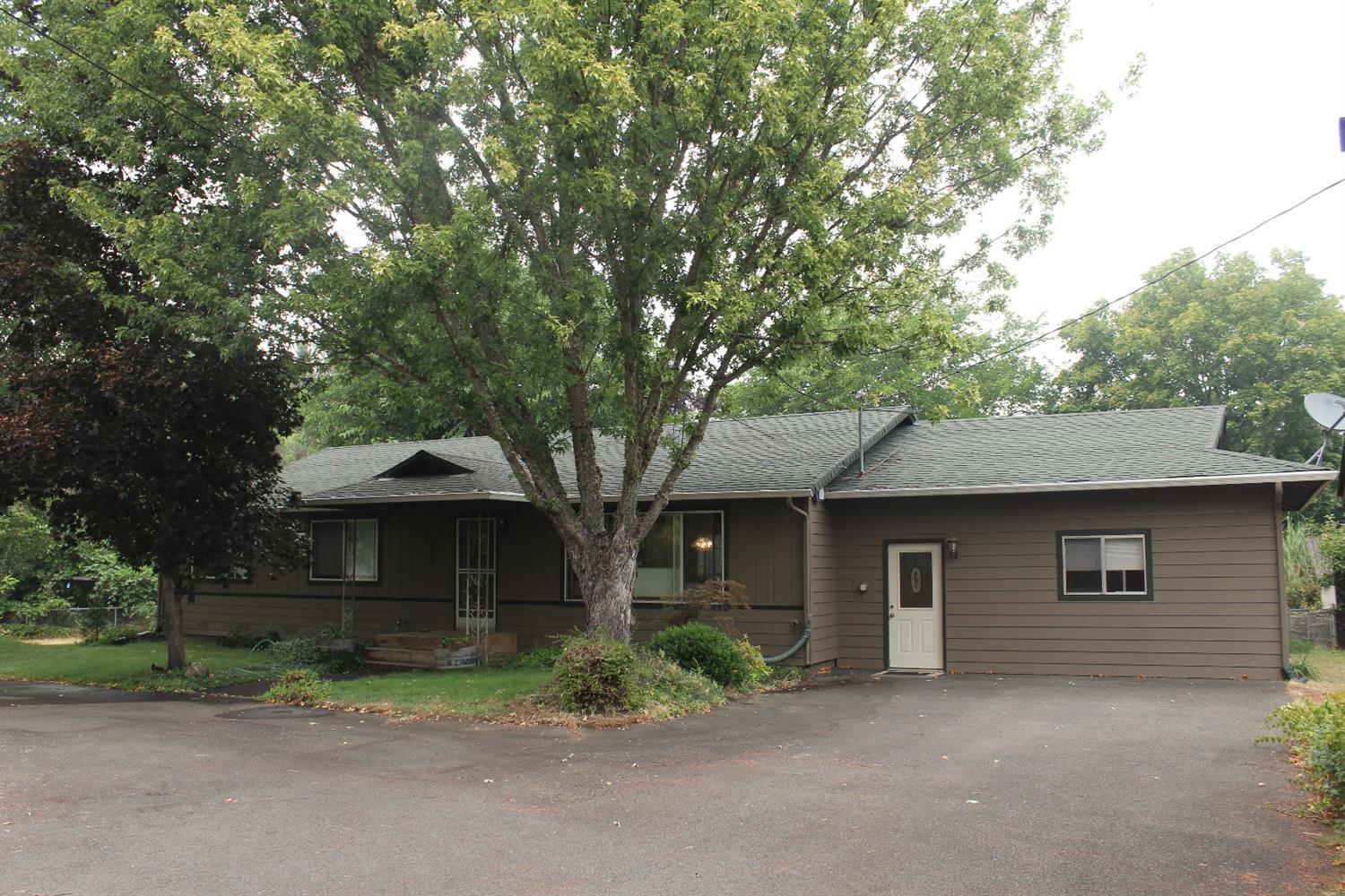 Beautiful well kept home on 1.03 Acre with approximately 2/3 of acre fenced in the back of home. There is a very nice garden area, a small barn, small decorative ponds, and wonderful fruit trees to enjoy the summer offerings (Peach, Apple, Grapes, Blueberries, Figs, Italian Plum, Black berries thorn less, Raspberries, Lemon Tree. There is also beautiful bamboo and big leaf fruitless mulberry shade trees. The circle asphalt driveway makes entry and exit of the property very convenient. This home is warm and inviting and feels like home. The very large back yard has a lovey Trex Deck for relaxing and BBQing and gives much privacy and room to spread out and enjoy!