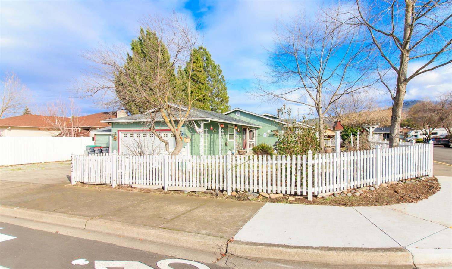 Hard to find single level 4 bedroom, 2 bath home in East Medford is now available! Built in 1991 with 1832 sq. ft. this home has been updated and offers some really nice touches. The living room features tile floors, wood burning fireplace with rock surround and built in bookshelves on either side. The kitchen is open to the dining area and living room. Master bedroom includes a window seat, built in bookcases, ceiling fan and an attached office area with french doors that lead out to the backyard. Master bath has tile floors, walk in closet and solar tube. The other three bedrooms all have laminate flooring. The hall bath has tile floors, solar tube and tiled shower. The backyard has a nice covered patio area with ceiling fan and also includes a shed. Make an appointment to tour this home today!