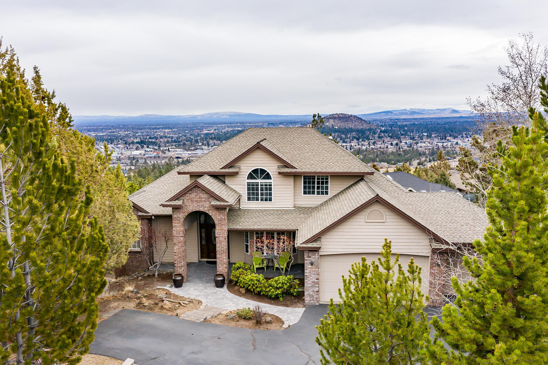Don't miss this beautiful home in the highly sought after Awbrey Butte neighborhood. This home offers gorgeous City and Pilot Butte views as well as Smith Rock and even Mt. Hood from the main level master bedroom. Spacious master bath large features soaking tub, tile shower, heated tile floors & walk-in closet. Vaulted great room with floor-to-ceiling windows overlooking peaceful views. Kitchen offers stainless KitchenAid appliances, slab granite counters and large island. Main level also includes formal dining plus large laundry room. Upstairs features 3 beds and a full bath with dual sink vanity. The downstairs allows a multitude of options with a large bonus room, game room plus 5th  bedroom with walk-in closet and a 3rd full bath.