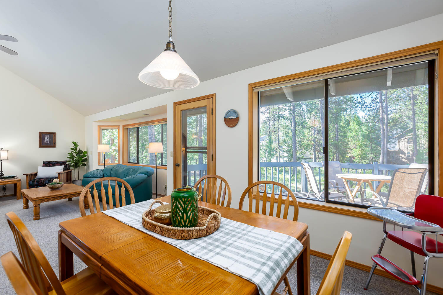 Welcome to 4 Oregon Loop! This charming Sunriver home sits among the soaring pines, offering a peaceful retreat minutes from all the action the resort has to offer. With vaulted ceilings, a river rock fireplace and ample windows overlooking the large lot backing to common space, this lovingly cared for home is offered turnkey, ready to enjoy. The ground-level main floor boasts an open floorplan with kitchen, dining, living, laundry, 2 guest bedrooms and a guest bath. Head upstairs to the private primary bedroom with it's own balcony, two closets, and en suite bath with dual vanity and walk in shower. Call your favorite broker and schedule a private tour today!
