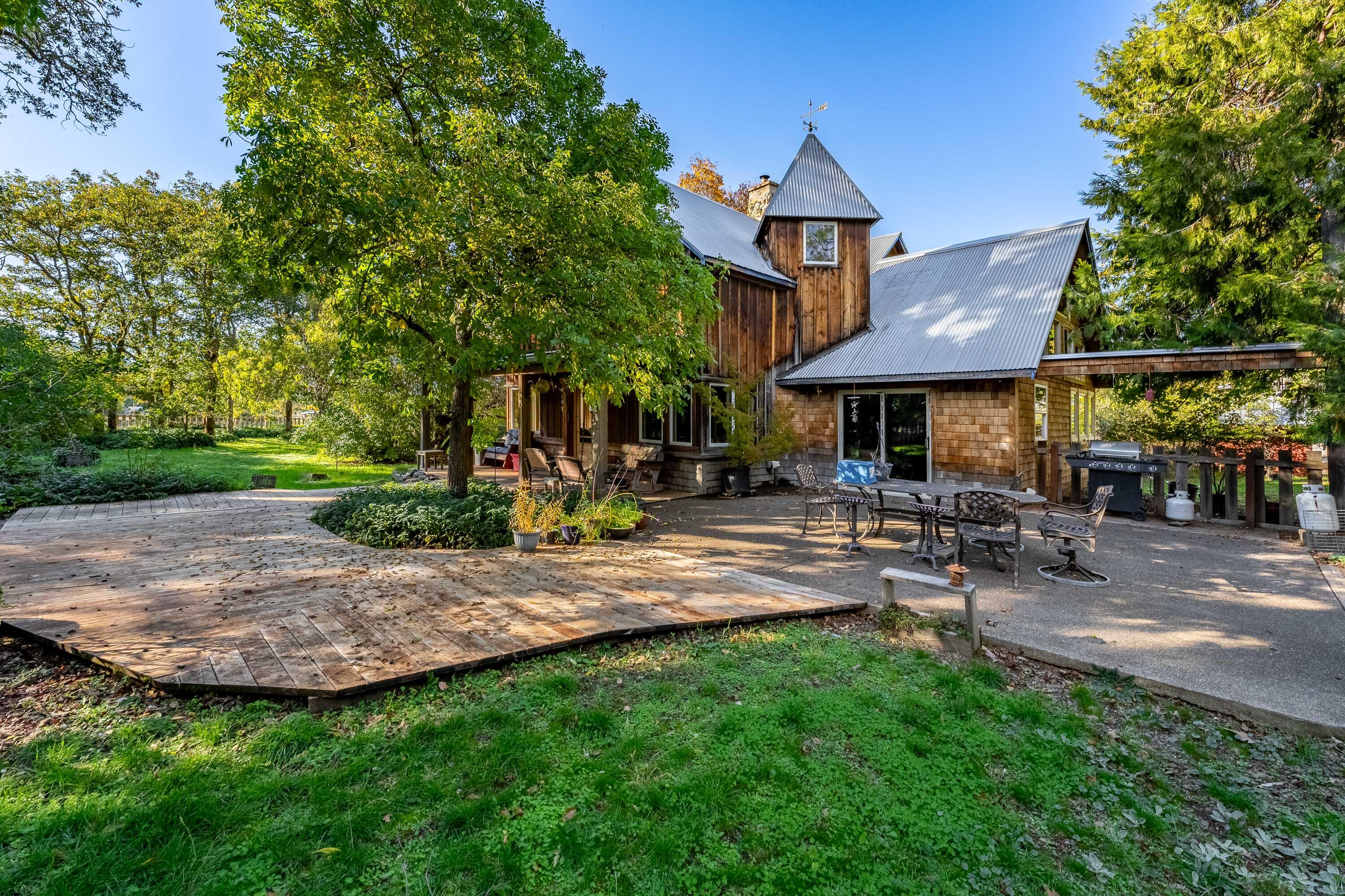 Private Farmstead Retreat with Water, Views & Multiple Dwellings!

Tucked away in the heart of the Illinois Valley, this exceptional property offers flat, usable farmland with abundant water and stunning views. The partially renovated main home is ready for your finishing touches, complemented by a charming guest house ideal for multigenerational living or rental income. Enjoy extensive water rights, creek and pond frontage, and a private setting that backs up to BLM land for endless recreation. A spacious shop and classic barn provide ample room for equipment, animals, or hobbies. Whether you're looking for a working farm, private retreat, or rural investment, this property offers the best of Southern Oregon living—peaceful, productive, and full of potential.