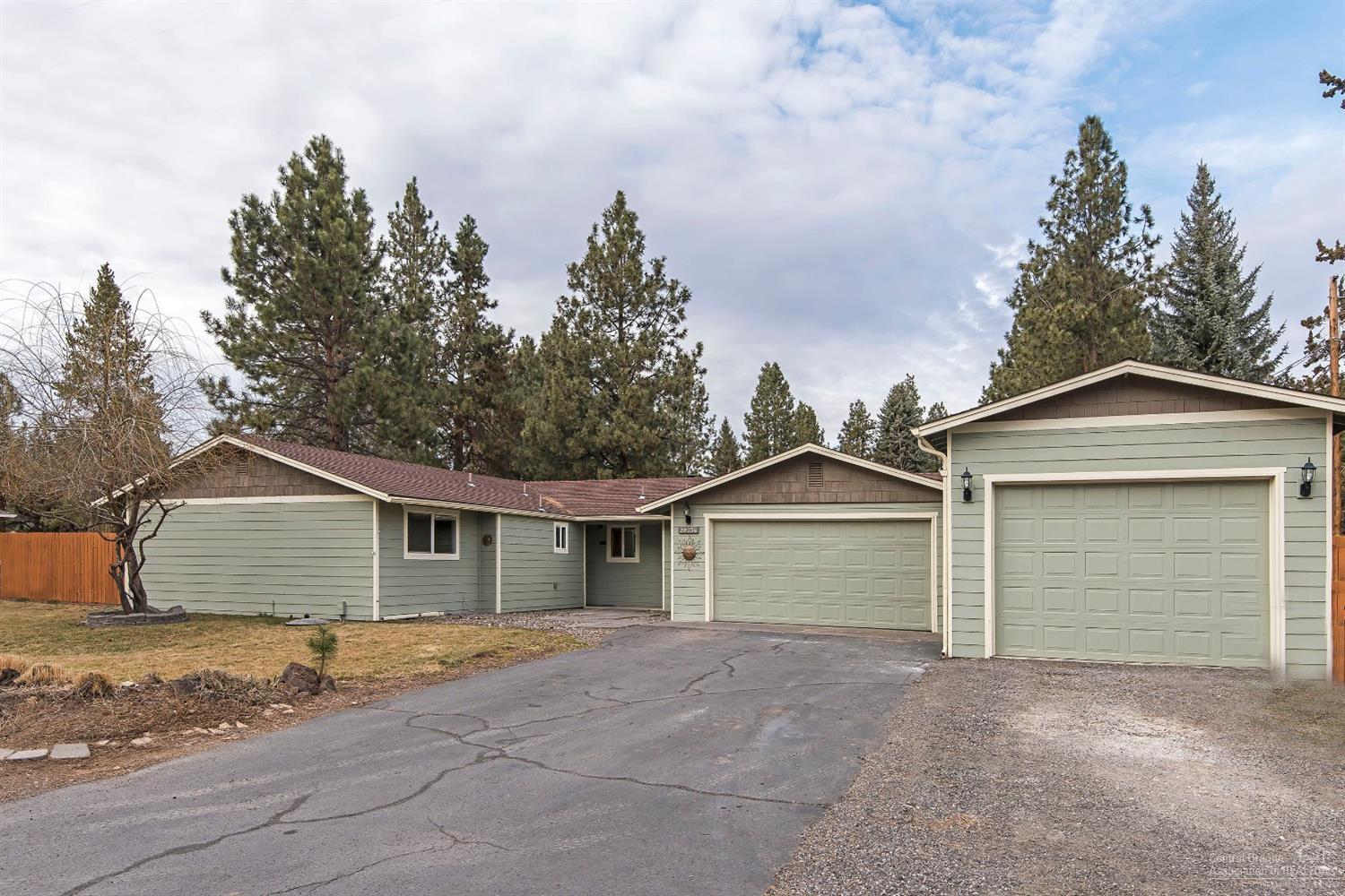 Enjoy a large lot in town in an established neighborhood featuring an spacious green house and extended patio area. Warm up inside next to a Montana Moss stone fireplace in the living room that is open to the kitchen and dining rooms. You'll also find a plethora of storage in the garage and shop.