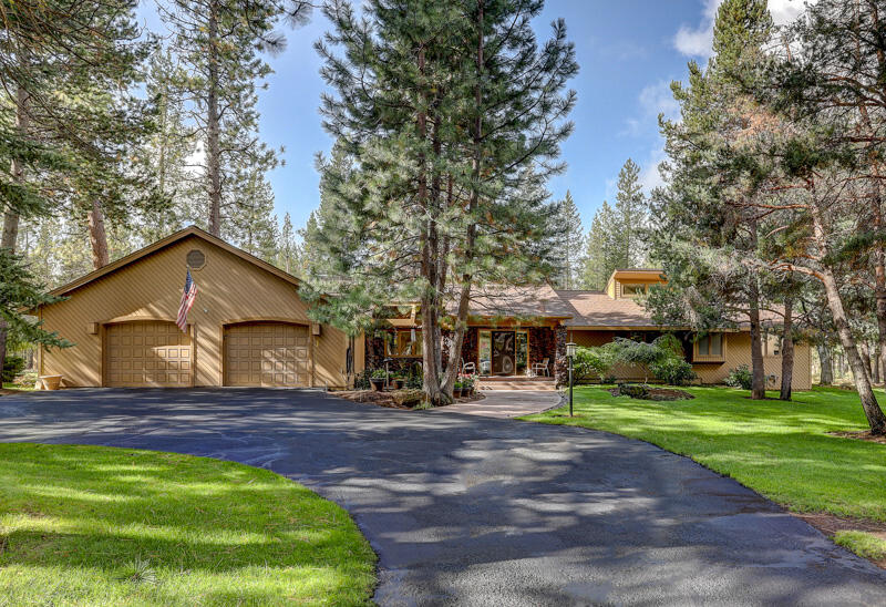 Exceptional Custom 3200sf Single Level in Sunriver's Meadow Village! Unique 4Bd/2.5Ba w/separate living areas include family room w/slate floor, tower-celestial skylight & water feature + living room w/open beams & gas FP,  2018 kitchen remodel w/SS appl, slab quartz counters, master w/big walk-in, sitting area & pvt bath w/dbl tiled vanity, jetted-tub & tiled shower, big back deck w/Hot Tub, 2+ att car garage w/shop area & steps to large bonus area above, circular driveway for parking, Gas FA Heating & Central AC all in a beautiful park-like setting!