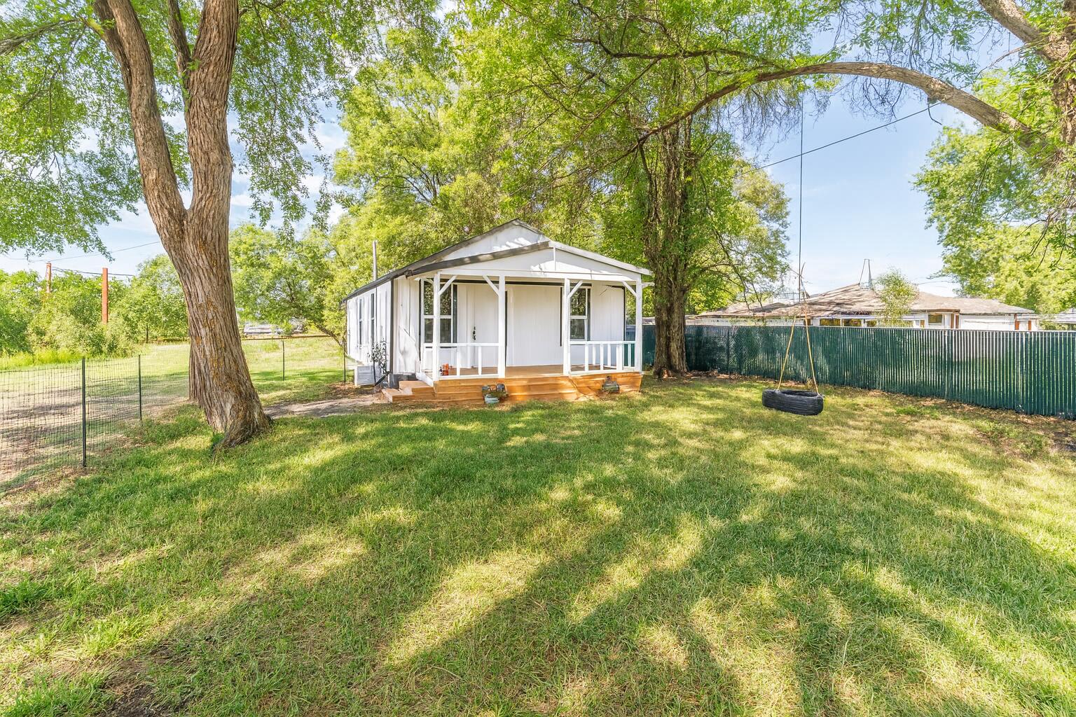 SMALL LIVING, BIG POTENTIAL. Thoughtfully remodeled home on a generous .25-acre R4-zoned lot in the heart of Prineville. This property embraces efficient, low-maintenance living while offering rare development and income potential—R4 zoning allows duplexes, ADU, multifamily up to 4 units, or RV rental income. County records show 2 bed/1 bath; the home lives as 3 bedrooms, 1 bath with an open, updated layout. Recent upgrades include new plumbing, modern kitchen with cabinets, countertops & appliances (refrigerator included), remodeled bathroom, ductless heating & cooling, tankless water heater, updated lighting, fresh interior & exterior paint, and a durable metal roof. Fully fenced front and back yards feature a garden area, chicken coop, multiple storage sheds, and ample RV parking. Seller can install an RV pad with hookups at additional cost. A perfect blend of simple living today and long-term upside tomorrow.