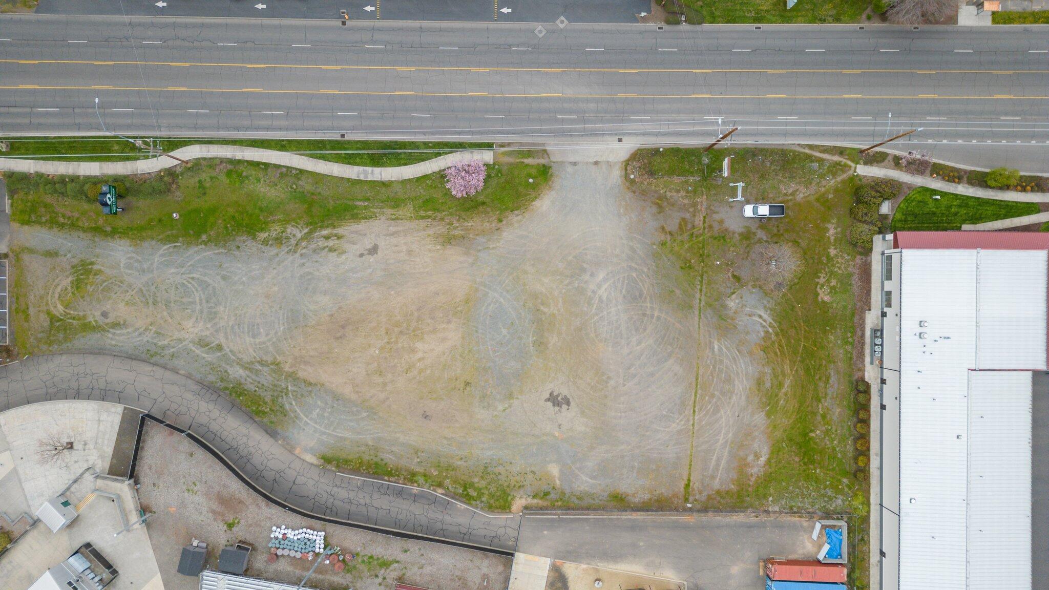 Highly visible commercial lot on busy road (+/-21,000 ADT) ready to be transformed into a new food truck court, drive thru coffee shop or restaurant. Located in front of
Harry & David Field, Home of the Medford Rogues and the Medford
Mustangs. Also adjacent to the entrance of Lithia & Driveway Fields. The
Medford Rogues welcome over 20,000 attendees to their field each
season. Lithia & Driveway field hosts hundreds of attendees throughout the
year on its 3 full-size baseball fields, 7 baseball/softball fields and 5
soccer/football fields. Zoned Regional Commercial this lot is ready for
someone with a brilliant idea.