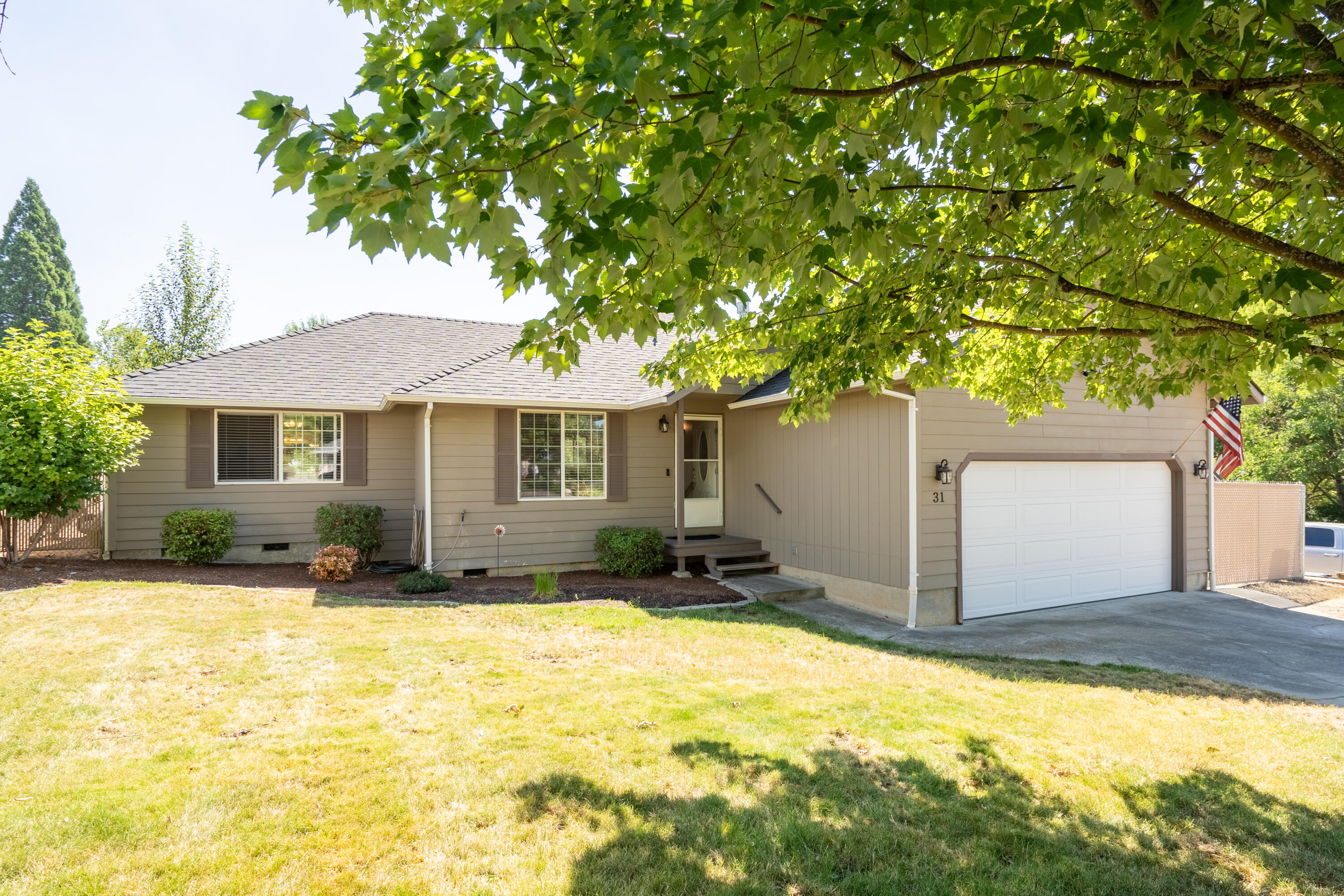 This three-bedroom, two-bath home comes with a solar system included in the purchase price. The current electric bill is less than $20 a month!! The layout features a split floor plan with a spacious great room at the center. The great room boasts high ceilings in the living area and vaulted ceilings in the kitchen, creating a bright and open atmosphere. French doors in the kitchen provide access to a large backyard, (inground sprinklers not currently being used) perfect for outdoor activities. The kitchen is equipped with a gas stove and ample counter space. Additionally, there is plenty of room to park your RV and/or boat next to the garage. Located on a quiet cul-de-sac in a comfortable neighborhood, this home is ideal for comfortable living.