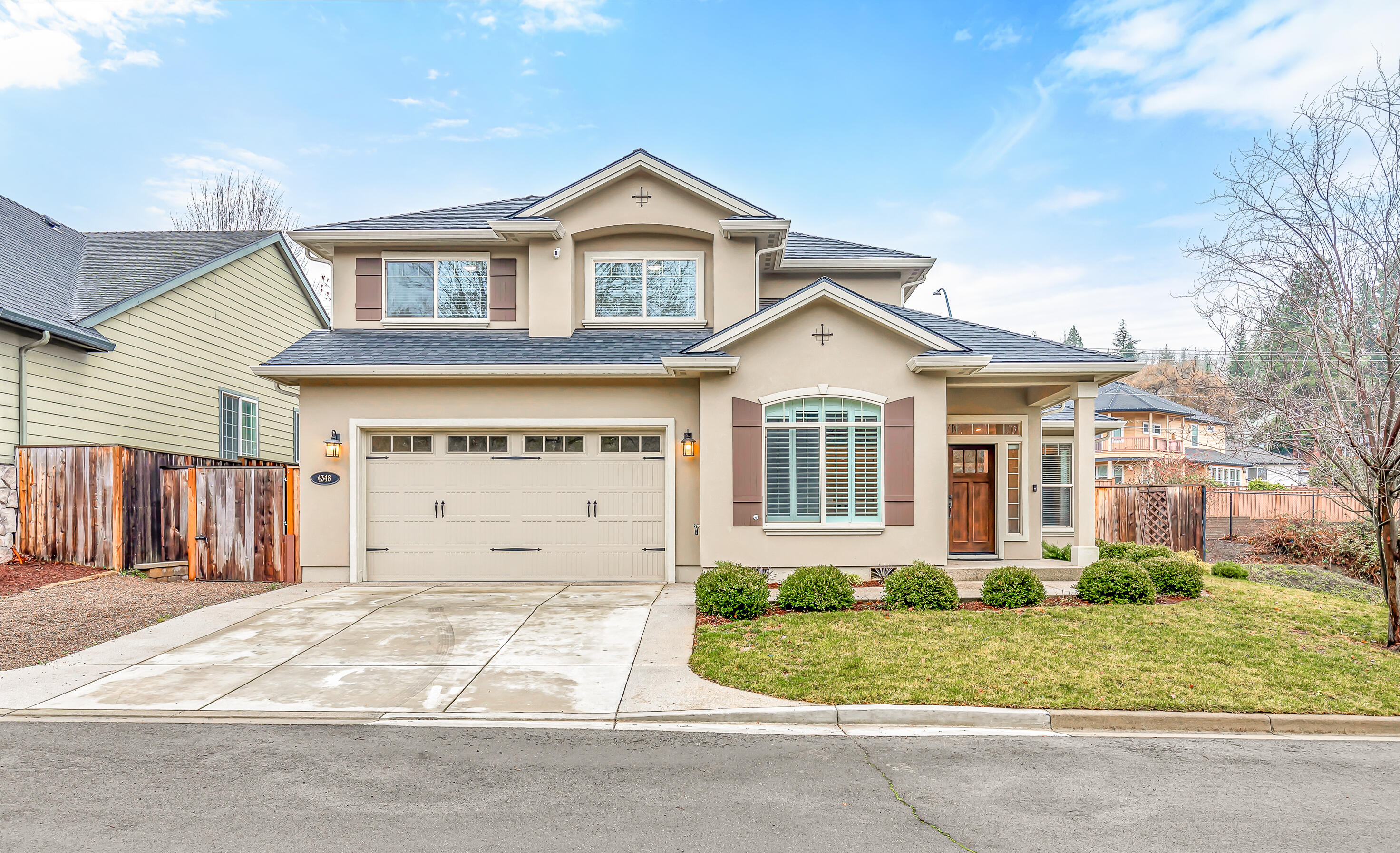 Desirable location!! Stunning East Medford Hills 4 Bedroom 2.5 bath w/ bonus room. Custom stucco and interior design/floor plan. Kitchen with 10FT granite top island, stainless appliances (included),granite counter tops, tile backsplash,under cabinet lighting, pantry and built in desk.Living and dining area are open to the kitchen to provide ease for gatherings/entertaining. Bonus room is perfect for media room, play room, home office or weight room. Primary suite downstairs w/large walk-in closet, bathroom with dual vanity and custom shower. Sliding glass doors off this suite go to the hot tub. Upstairs 3 more bedrooms and bathroom with dual vanity. Backyard fun with this easy care yard, covered patio, extended concrete patio, built in hammock and HOT TUB ( included). Come take a tour of this beautiful home.