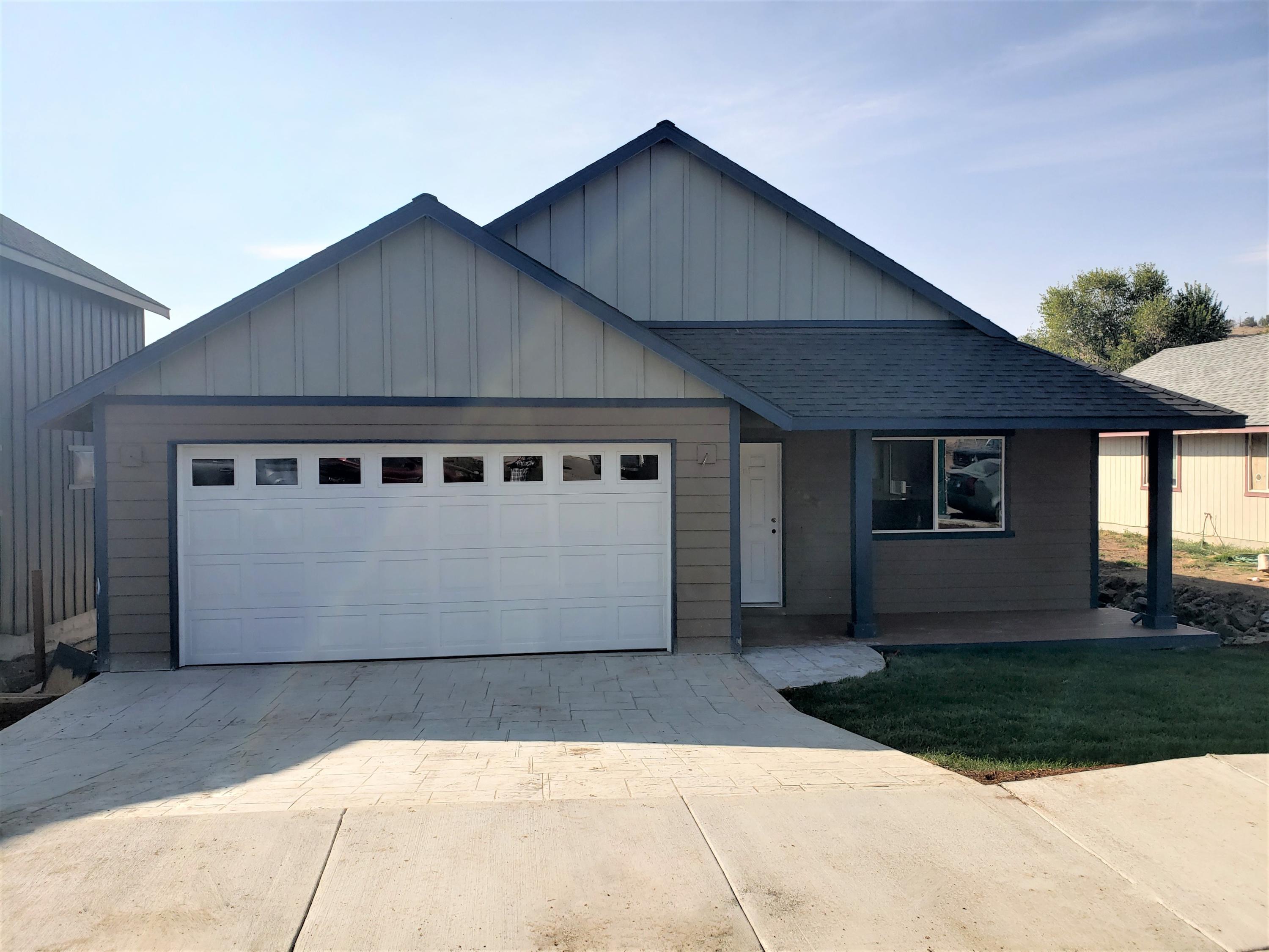 Nicely appointed, new construction home on Madras' SW side. Offering a front porch, hard surface counters and stainless steel appliances. The backyard is spacious with endless possibilities. Close proximity to shopping, amenities and schools. City states street will be paved in 2021.