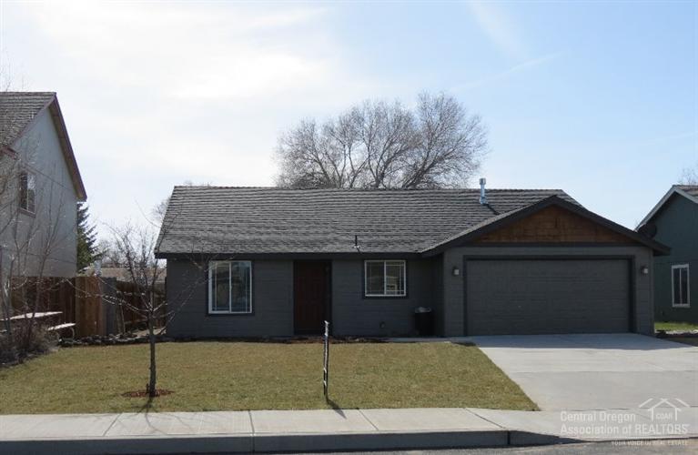 Large living area with vaulted ceilings and gas corner fireplace, tile entry, tile accents throughout. Double sinks in the master bath and a walk-in closet. Pre-plumbed for central vac. Single level 3 bedroom, 2 bathroom home with 1465 SF and feels larger. Huge double car garage, lot is fenced. Very close in with close by. Vacant and ready to go.