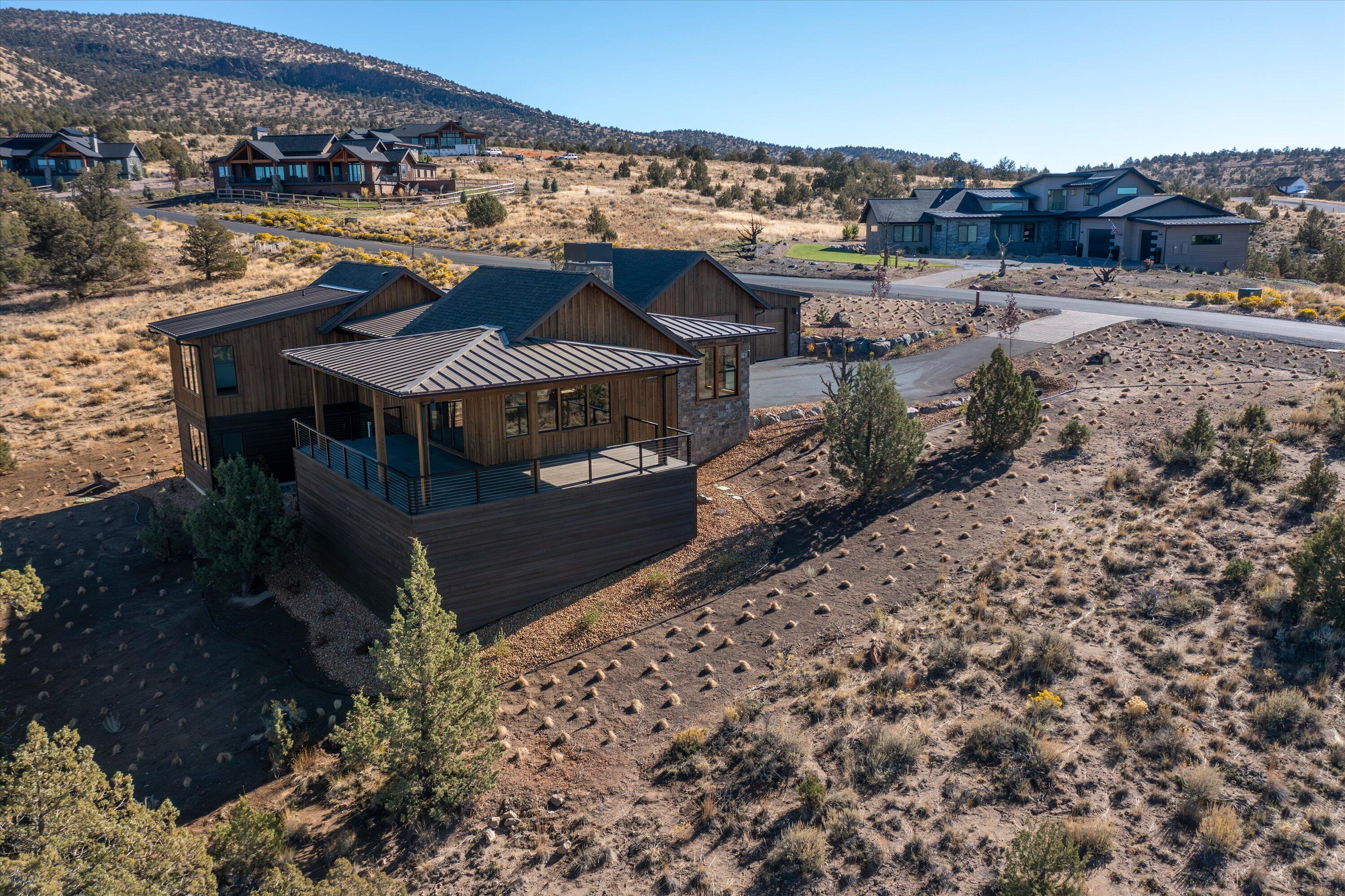 Incredible NW Style New Construction home with expansive views of the magnificent Cascade Mountains off of the spacious wrap around porch. This home offers an open floor plan with hardwood floors throughout, a capacious kitchen, open dining room, an office, and a Great Room that features a solid stone fireplace. The primary suite has views of the Mountains, while bounded by the privacy of Spirit Rock, a large walk-in closet, double vanity, a soaking tub, and a floor-to-ceiling tile shower. Downstairs you will find a spacious bonus room, two additional bedrooms with a full bathroom, a back patio, and a generous three bay garage complete the home. Enjoy all the Benefits of Membership, Athletic Center with 3 Pools, Water Slide and Lazy River, Cascade Pool (Adult Only Pool), Equestrian Center, 18 Hole Award Winning Golf Course, Spa Brasada, Member Club Room, Restaurants, Hiking, Biking, Fishing, Horse Back Riding and much more!