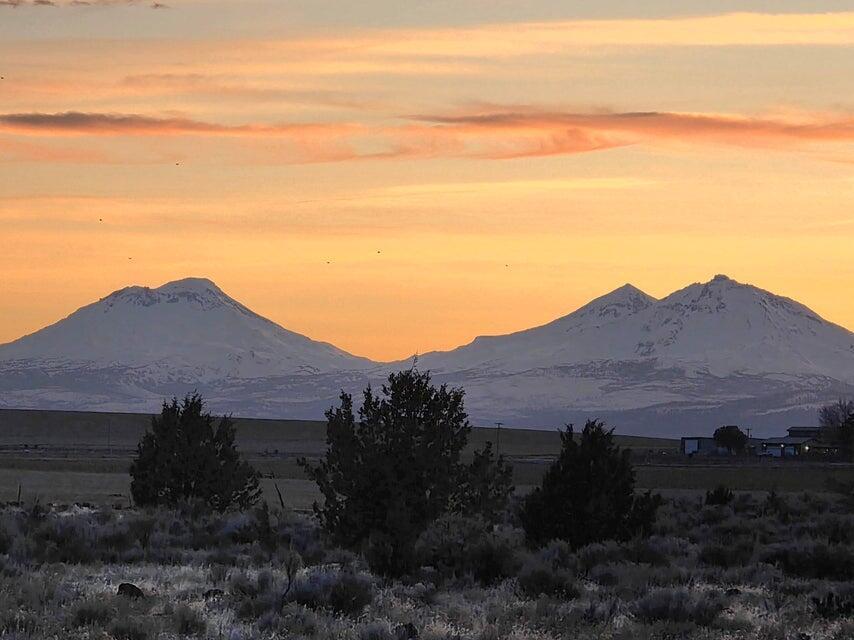 Discover the potential of this stunning 84-acre buildable parcel in the heart of Central Oregon! With breathtaking, unobstructed views and endless possibilities, this property is a rare find. Fully fenced and ideally suited as a horse property, it offers ample space for your equestrian dreams or other ventures.  The property comes equipped with a storage garage and a valuable utilities credit to get you started. With water and power conveniently located at the property corner and an approved septic evaluation on file, building your dream home or getaway has never been easier.  This truly remarkable piece of land invites you to create the lifestyle you've always imagined. All photos were taken at ground level, showcasing the genuine beauty of this unique opportunity.  Displayed address is only for directional purposes.