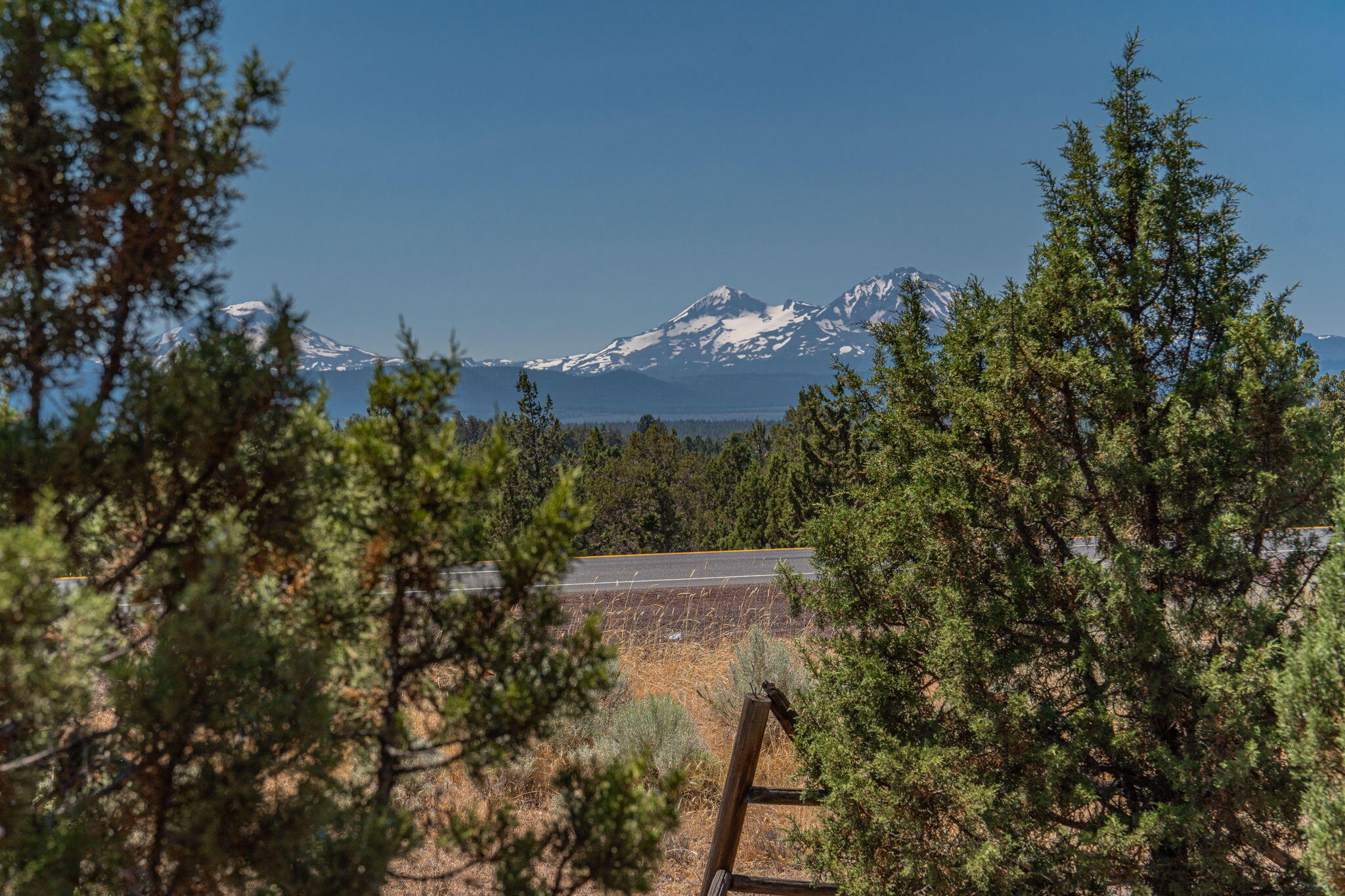 Discover your dream estate in the heart of Tumalo's coveted ''Triangle''. This 22.29-acre parcel offers panoramic views of Three Sisters, Mt. Bachelor, and Black Butte. Perfect for equestrian enthusiasts with 6 acres of Tumalo irrigation rights. Wildlife abounds with annual elk visits. Power is already on-site, and the land is buildable. Just 7 miles from shopping, groceries, and Costco. Ideal for creating your private retreat or working ranch. Buyer to verify all potential uses. Don't miss this rare opportunity!