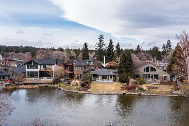 This beautiful riverfront home is situated in downtown Bend, near all the amenities that Bend has to offer. With two bedrooms and a separate office, this home boasts an open floor plan, with a private deck in back with hot tub. Enjoy a glass of wine as you watch the geese settle onto Mirror Pond. Or enjoy the restaurants and food carts just a few blocks away on Galveston and Newport Ave. Launch your kayak or paddle board from your back yard. Live the life you deserve.