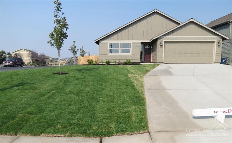 You are going to love this new construction home in the SW Redmond neighborhood of Julina Park. 1,814 SF of living space all on one level with 3 spacious bedrooms, 2 full bathrooms. The home features vaulted ceilings in the living room, a family room off the custom kitchen and laminate flooring in the main living areas. Great curb appeal through a double car attached garage, full landscaping with sprinkler system, fencing and a nice corner lot location. Model home open Friday through Sunday 12 to 5.