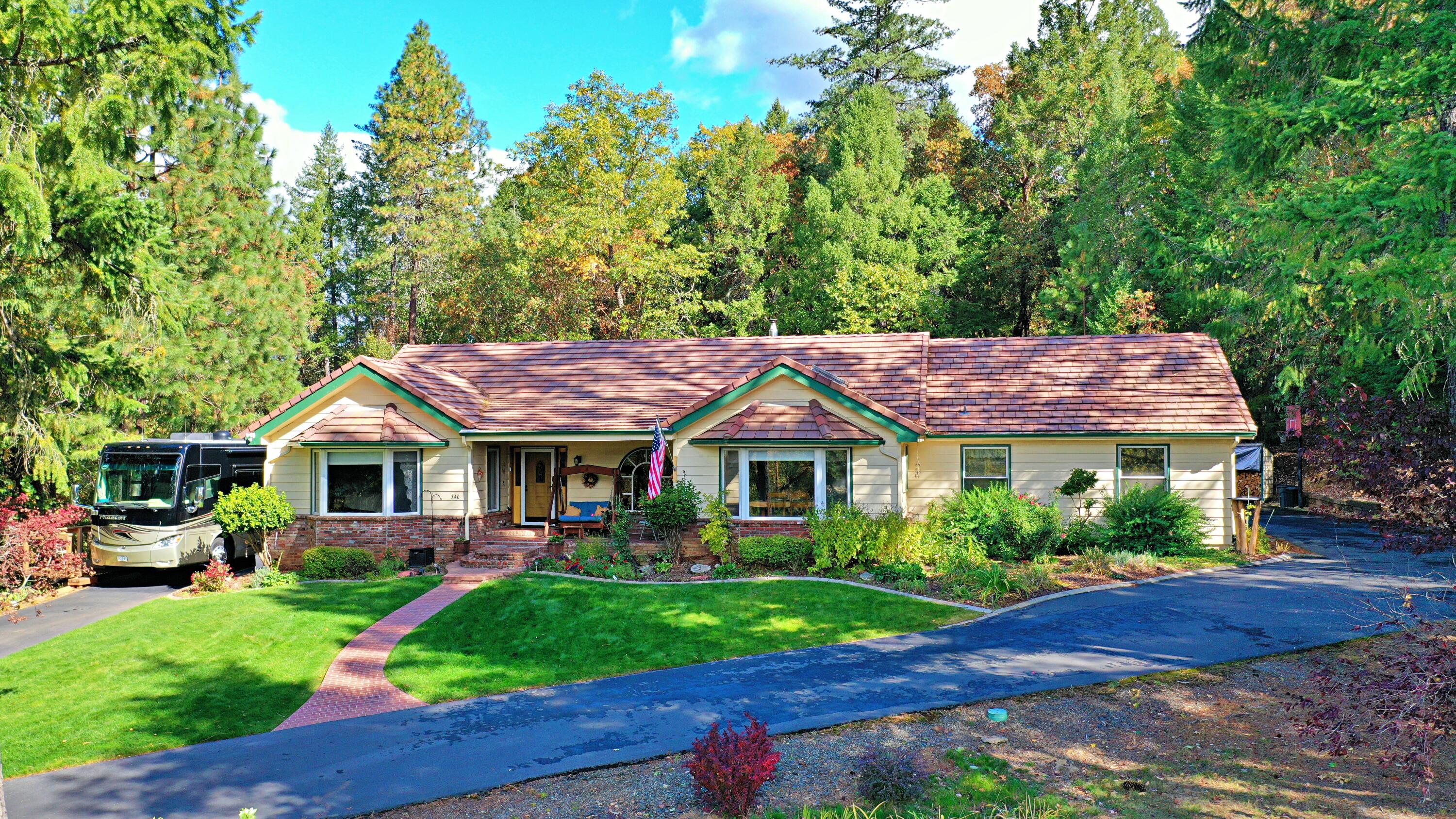 Come take a look before this well maintained home is gone. This 2662 sq/ft, 4 bedroom, 3 bathroom, 2x6 framed home shows pride of ownership thru-out. There are 2 master suites with full bathrooms, great room, office, living room, laundry room with walk-in pantry, garage & heated/cooled shop connected by a breezeway, paved driveway & RV parking with full hook ups with its own deck. Nestled in a 2.92 acre property at the end of quit cul-de-sac. The home offers vaulted, tongue & groove ceilings with wood beams in the master bedroom, kitchen & great room that add depth & beauty to the interior, the kitchen has a granite counter island with eating bar & slab quarts counter top, the luxury vinyl plank flooring adds a truly welcoming feeling. The wood fire place in the great room keeps the whole house warm & the large brick hearth allows for enjoying the fire while sitting around the stove. New tile roof, skylights, gutters, exterior painting, Trex deck & kitchen renovation completed in 2016.
