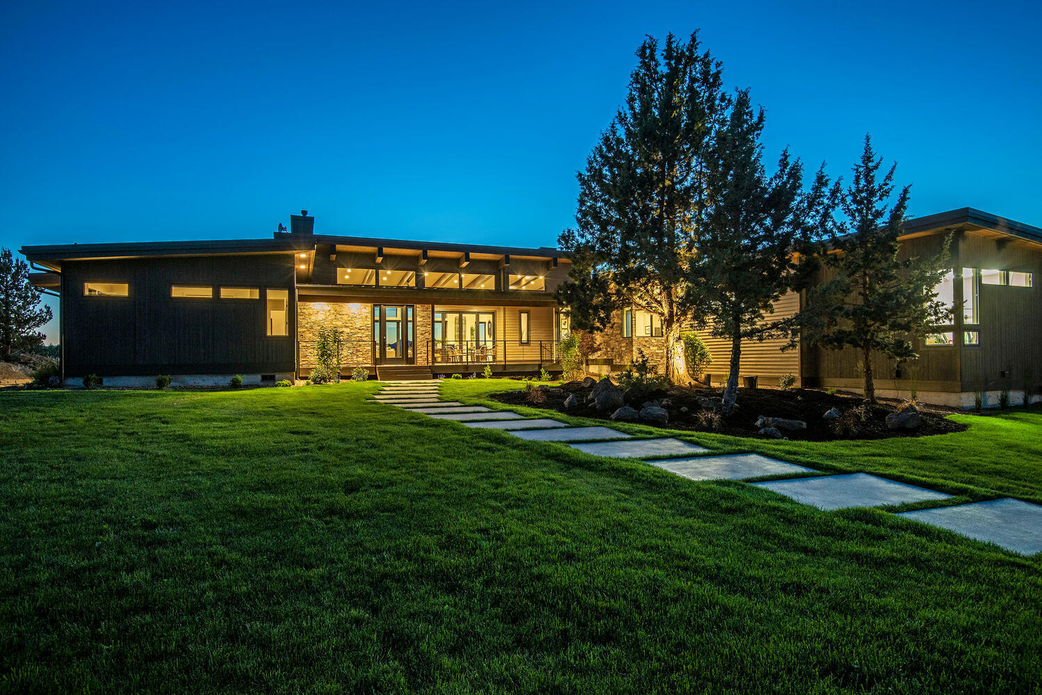 This unique mountain modern home has open concept living sitting on nearly 10 acres of rural land. Upon entry, the unobstructed Cascade Mountain views are showcased by the high ceilings and gorgeous wood beams running throughout the entire main living area. The chef's inspired kitchen is equipped with Thermador appliances, including a plumbed in coffee maker, wine fridge, and 2 dishwashers, making it easy to entertain. Panoramic doors sit on opposite sides of the great room, giving the ability to fully open up the house & enjoy true indoor-outdoor living. This single level home has a master suite and 2 guest suites, a large bonus room, and office. The master sits on its own wing of the home, and has picturesque views of the Cascades. Master bath is sleek and modern with a curbless steam shower, soaking tub, and dimmable LED lighting, making every day feel like a spa experience. Home is complete with a matching 2,500 sq ft shop for all of your toys.