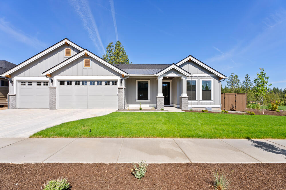 MOVE-IN READY home Site 17, nestled under Ponderosa Pines, is part of the Collier community by Pahlisch Homes. The Bentley floor plan features open, light-filled spaces with expansive windows. Designed for privacy, it includes two guest rooms (one an en-suite) and an office on one side of the home, with the primary suite on the other. Luxury finishes like JennAir appliances, a tile walk-in shower, and engineered hardwood floors complete this exceptional home. Nearly every home backs to green space, offering a peaceful retreat. Just under a mile from Northwest Crossing's shops, restaurants, parks, and schools, you'll enjoy convenient access to all northwest Bend offers. Miles of trails lead right from your backyard and the location offers easy routes to Mt. Bachelor and the Cascade Lakes.