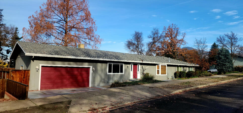 Are you wanting an early Valentines Day present? Imagine entering into one living room, where a pool table is already set up with overhead light and wall-mounted cue rack—perfect for entertaining friends and family—while the other living room welcomes you with a cozy fireplace. This spacious East Medford home on a corner lot offers 3 bedrooms, 2 bathrooms, and 2,059 ft². Whip up meals in the beautiful newer kitchen or host dinners in the outdoor kitchenette area while enjoying backyard raised garden beds. Huge RV parking with water, sewer, and electric hookups makes storing trailers, toys, or extra vehicles easy. With a functional layout, bright natural light, and a prime location near shopping, restaurants, and schools, this home combines comfort, charm, and convenience—you won't want to miss it!