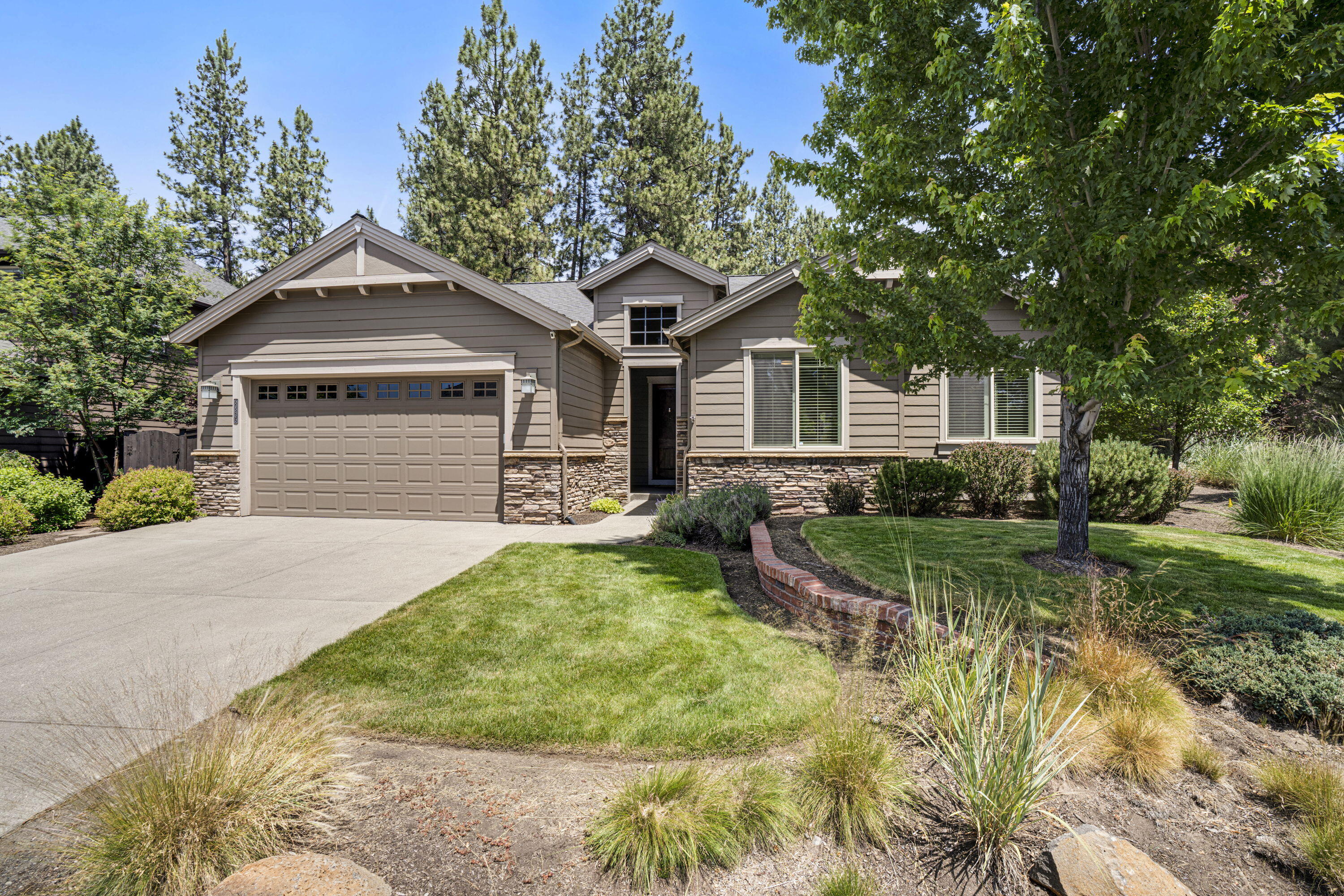 Welcome to the sought-after neighborhood of Stonegate. Enjoy the community pool, hot tub, pool house, walking paths, open space & playground! This pristine single-level home has been meticulously maintained and boasts too many improvements to list. The spacious great room features engineered wood floors, skylight, arched doorways, and a natural gas ledgestone fireplace with hearth. The stunning center island kitchen includes quartz countertops, decorative tile backsplash, stainless appliances, recessed wood cabinets, pantry, and breakfast bar. The primary suite has vaulted ceilings, a walk-in closet, dual vanity, pocket doors, and tile flooring. The dining area leads to an outdoor living space with a 26'x29' covered paver patio, perfect for lounging and entertaining. The front yard is maintained by the HOA, providing ease and relaxation. A fabulous corner lot, fenced backyard with an elegant rock hardscape, paver stone walkway, established plants, low-maintenance, eco-friendly design.