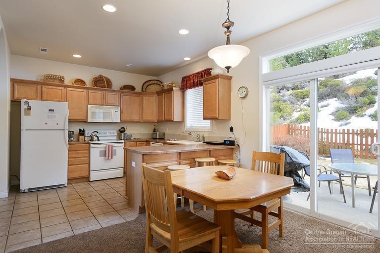 The perfect Bend getaway! Enjoy privacy and convenience in this completely furnished turnkey home. Located just minutes from Downtown, The Old Mill, Deschutes River Trail hiking, golf, and just off Century Dr as it heads up to Mt Bachelor only 20 minutes away. Large fenced back yard w/hot tub nestles up to a hillside and open space offering a country feeling in the city. Home has been kept as a vacation rental and comes with a highly coveted grandfathered transferable type II STR/Vacation Rental Permit!