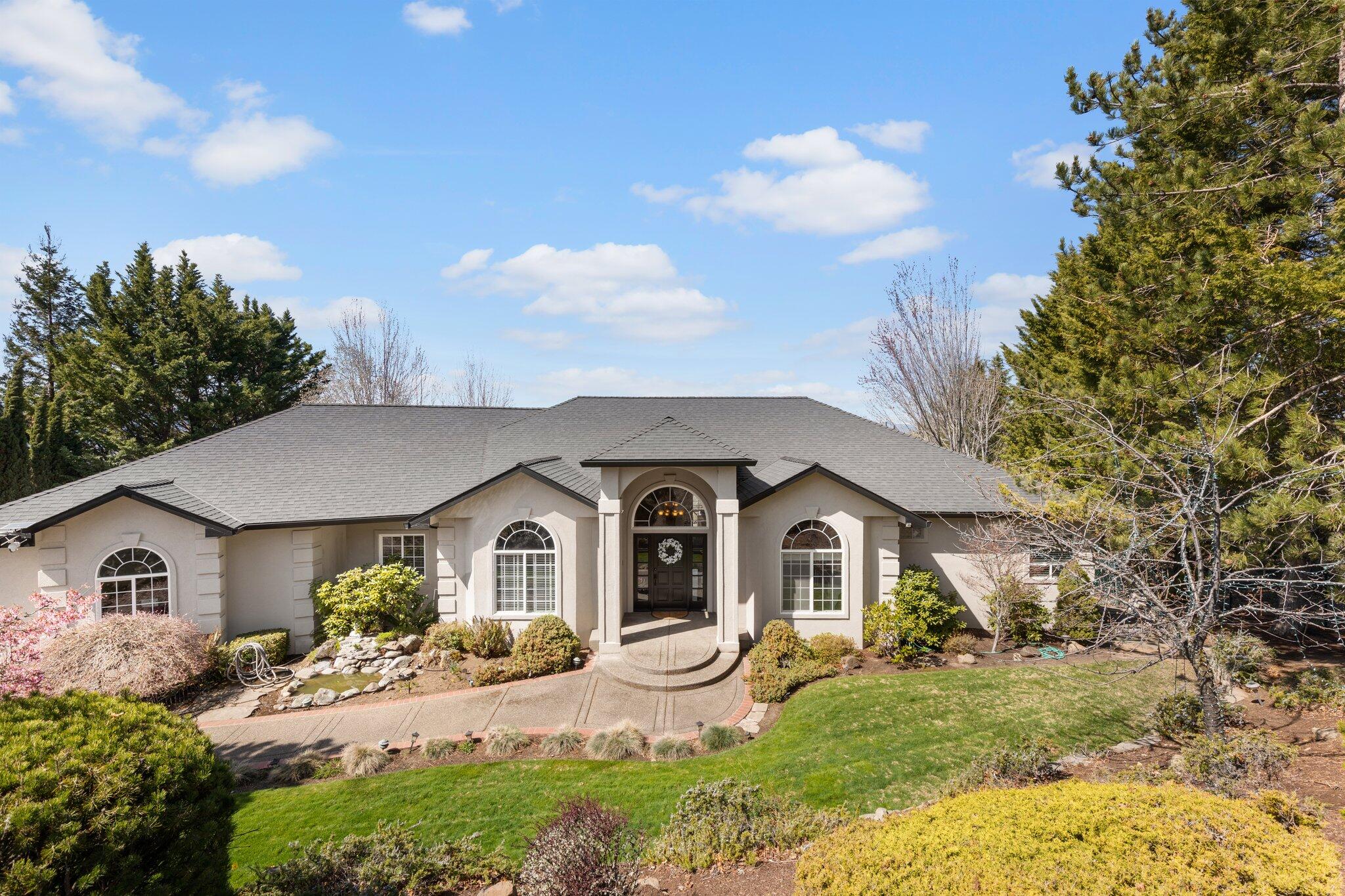 Incredible views! Truly an amazing home and location, located at the end of the road with only one neighboring home. This home features 3867 sq ft, 3 bed and 2 full plus 2 half bath and an office. Walk into the grand foyer and enjoy the wall of windows across the large livingroom for a breathtaking view indoor and out while experiencing vaulted ceilings, tasteful archways, hardwood and tile floors! Step into your light and bright kitchen that is updated with granite counters and high end appliances. Luxury main level primary suite has double sink vanity, heated tile floors, oversized soaking tub, steam shower & large walk-in closet. The lower level includes a family room & and 2 bedrooms plus a guest bathroom. Huge in-ground pool with solar heating. The grounds are beautifully mature and park like while you sit in the lighted Gazebo for a romantic evening or have friends and family over for a backyard BBQ. 3-car attached garage. Must see!