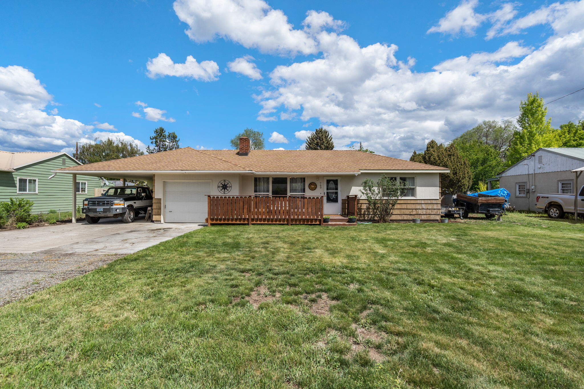 Charming 1955 Ranch style cottage in great neighborhood near the fairgrounds. Home is light and bright with vinyl windows and freshly painted throughout. Living room
with brick surround pellet stove and mantel. Updated natural gas heating and cooling system. Kitchen has solid wood cabinets, laminate counters, & tile backsplash.
Laundry/mudroom off the kitchen has built in storage & utility sink. Two good sized bedrooms and large primary suite with dual closets and big windows. Bathroom is
located between the bedrooms and has been re-done with new cabinetry, double sinks and large/tub combo. Outside is a covered patio for entertaining, large yard with
newer fencing. Backs up to alley with gate for access. Room for RV/Boat storage under covered carport or on other side of house. Single, attached garage for additional
storage as well as small storage shed on back of carport. Great location just a short walk to the fairgrounds for all the summer festivities! Close to schools.