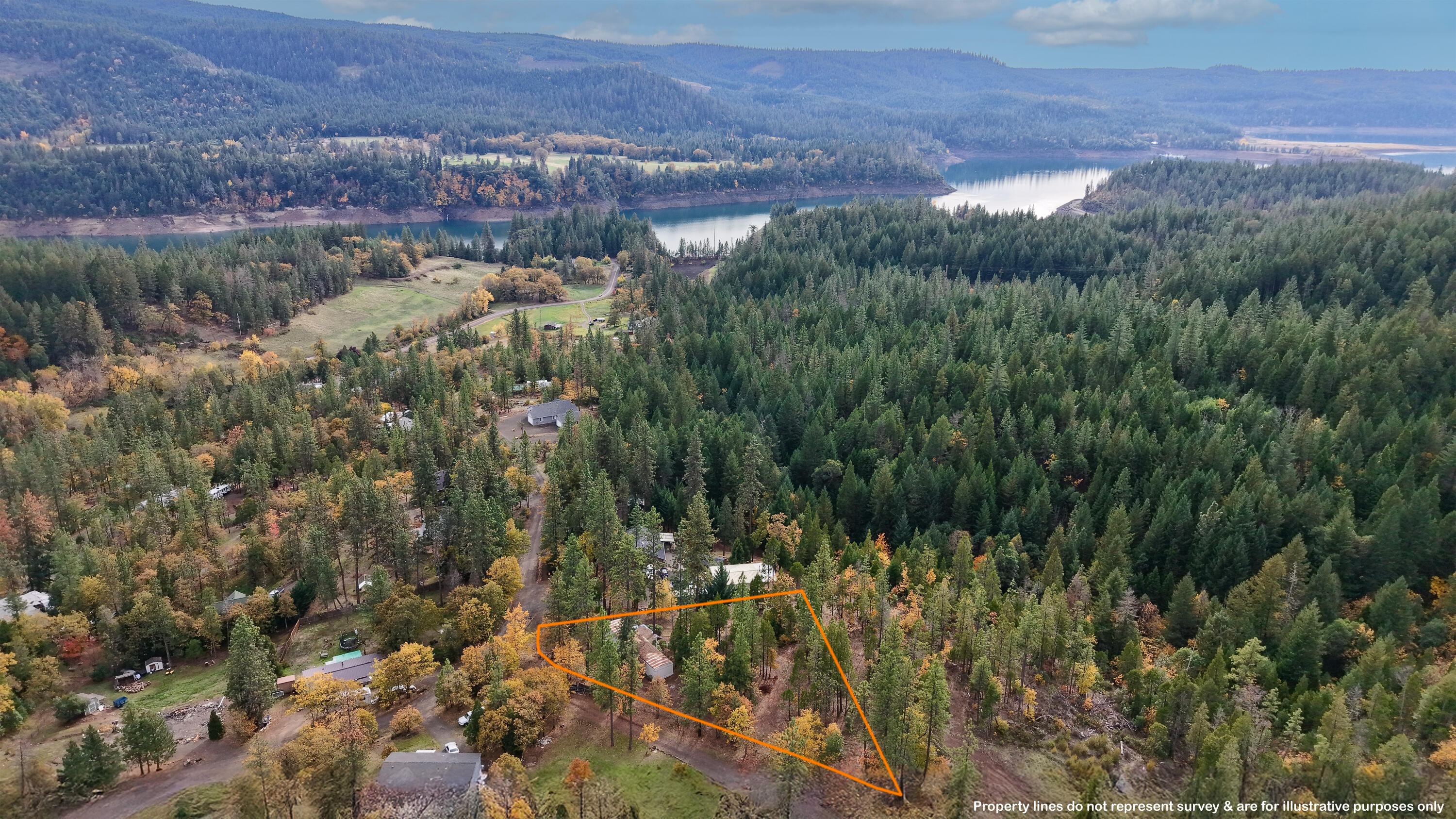 Rare opportunity on a 2/3-acre lot in Evergreen Meadows! One of only two homes on the very short Horse Ranch Road, this property offers privacy, peace, and abundant wildlife.  Just a short distance to HUNDREDS of acres of public land, enjoy endless hiking, trail riding, hunting, and year-round outdoor recreation just steps from your door. The 1977 manufactured home features 2-bedrooms, 1-Bath, and 924-sq. ft., ready for renovations—perfect for a handy buyer, investor, or flipper. Build your dream home or remodel the existing home on this highly desirable lot just above Lost Creek Lake. Community water system and good septic are in place. Owner carry terms available with a large down payment, though cash is preferred. Do not enter the property or home without an agent present. A rare, private retreat with huge potential for outdoor enthusiasts or anyone searching to create their ideal mountain getaway!