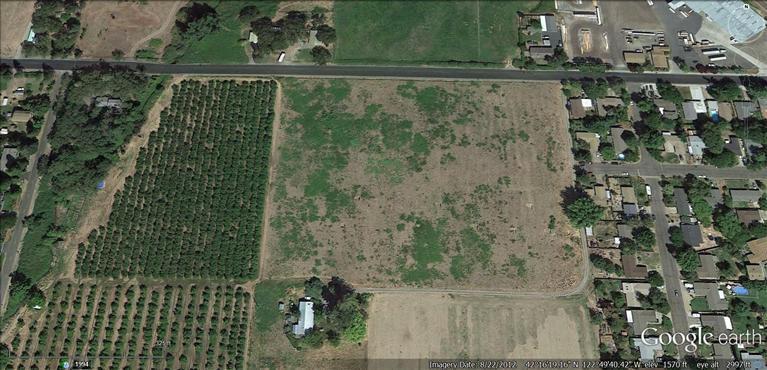 Trifecta! Exceptional & hard to find; 3 homesite approvals on 10.1 +/- great, buildable acres. Located just outside the Urban Growth Boundary, west of Phoenix. Good silty loam soils with TID Irrigation for growers, multi-family setup, or builders future development. Country lifestyle close to Ashland cultural amenities and could be great plot for small cropland varieties or 4H.