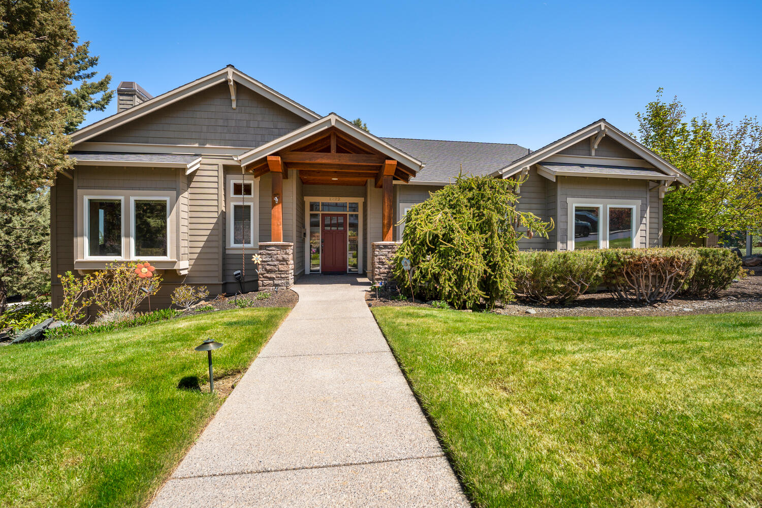 Yes! Finally the single-level home you've been waiting for. Sitting on a quiet corner lot, this 2004-built craftsman is so well maintained and offers views of both Mt Jefferson and Smith Rocks. Great room features beautiful hardwoods, gas fireplace, and loads of natural light. Gourmet kitchen has slab granite counters, island, breakfast bar, high-end appliances, desk, and pantry. Front-facing den with french doors. Quality millwork, built-in vacuum, AC. Generous primary suite features dual vanities, jetted tub, walk-in closet, and tiled shower with  multiple heads and heated floors. Private deck with mountain and Smith Rocks views.  Fenced yard with bonus storage under the house. Generous 3-car garage, plus mud room. Offering the best of Awbrey Butte, including outdoor tennis (just up the hill), golf, trails, downtown, and NW Crossing.