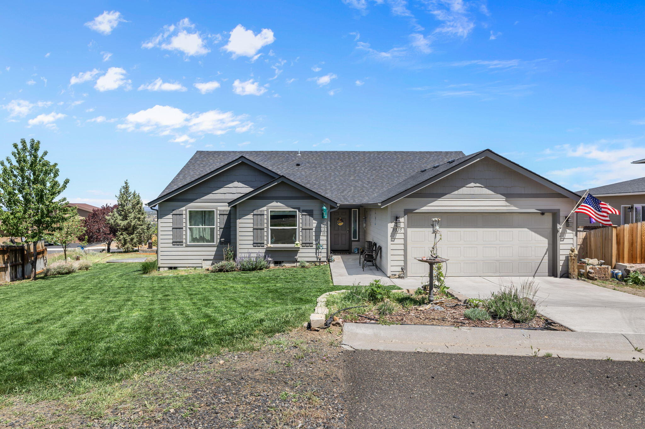 The perfect SW Redmond single level in Valleyview with stunning Smith Rock, Mt Jefferson, and city views! Enjoy panoramic twinkling city lights in the evening from your spacious, vaulted great room. Beautiful kitchen features an open floor plan, kitchen island and a humongous 5'6'' x 8'2'' walk-in pantry.
There is an abundance of space for all with 3 full bedrooms + a bonus/flex/office or 4th bedroom for whatever you might need!  Gorgeous primary suite with high ceilings and walk in closet & extra linen storage. Dimmers and LED lights new in home includes: ALL 22 ceiling + 8 fixture, outdoor, garage, + back porch (lifetime warranty to never go out, a value of 3k) and a full 360 around the house inground water/sprinkler system. Situated on a quiet, dead-end street for extra privacy and parking plus a lovely yard full of lavender + Apple, Cherry and Maple trees. A fantastic location and lot. Assumable VA loan at 2.625% vets only. Job is forcing relocation - sellers love the home