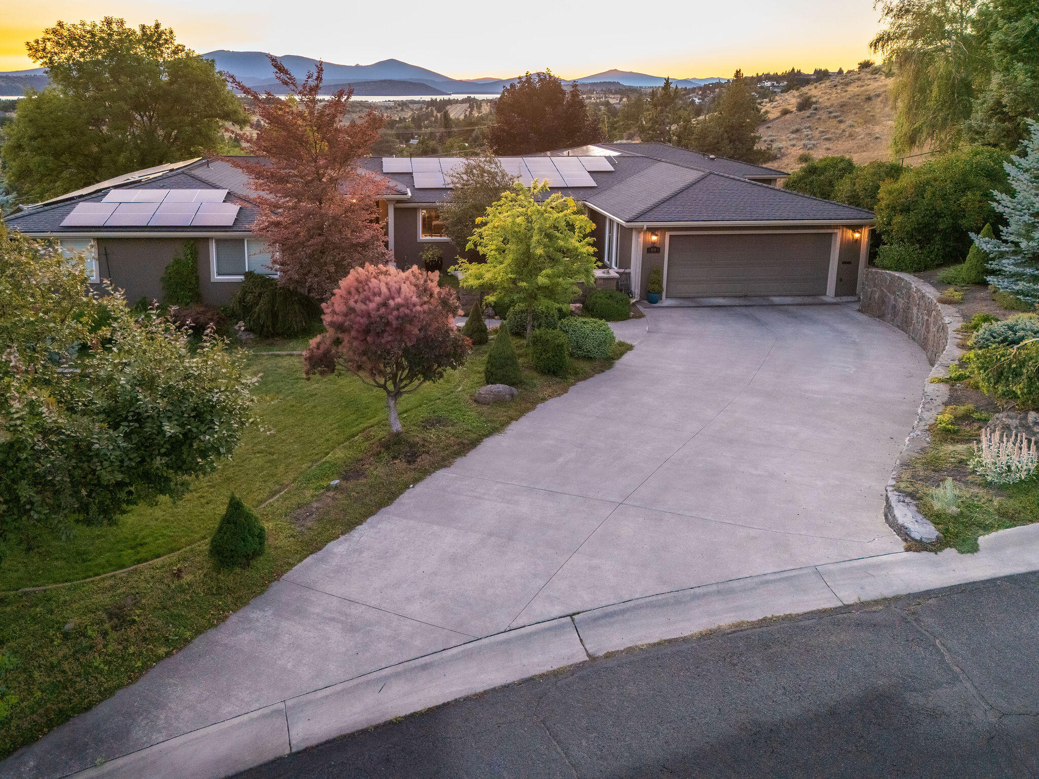 Single level home offering comfort, functionality & luxury. Step into the heart of the home boasting a large living room with massive windows capturing views of Klamath Lake, gas fireplace, and a custom bar. Gourmet kitchen with custom cabinets, granite countertops, stainless steel appliances, an island, coffee bar, and breakfast nook. Formal dining area is perfect for entertaining as well! Primary suite includes exterior access, lake views, a walk-in closet, and a custom tile shower with seat. On the opposite end of home, you'll find a second primary suite, also featuring a private entrance. Spacious laundry area including an impressive amount of additional pantry storage, off which is the extra deep two-car garage & attached workshop. Step outside to a partially covered deck with spectacular views of both Klamath Lake & Lake Ewauna. The geothermal-heated pool, driveway and pathways adds year-round enjoyment to the outdoors. Whole-home and patio wired for sound. Solar panels.